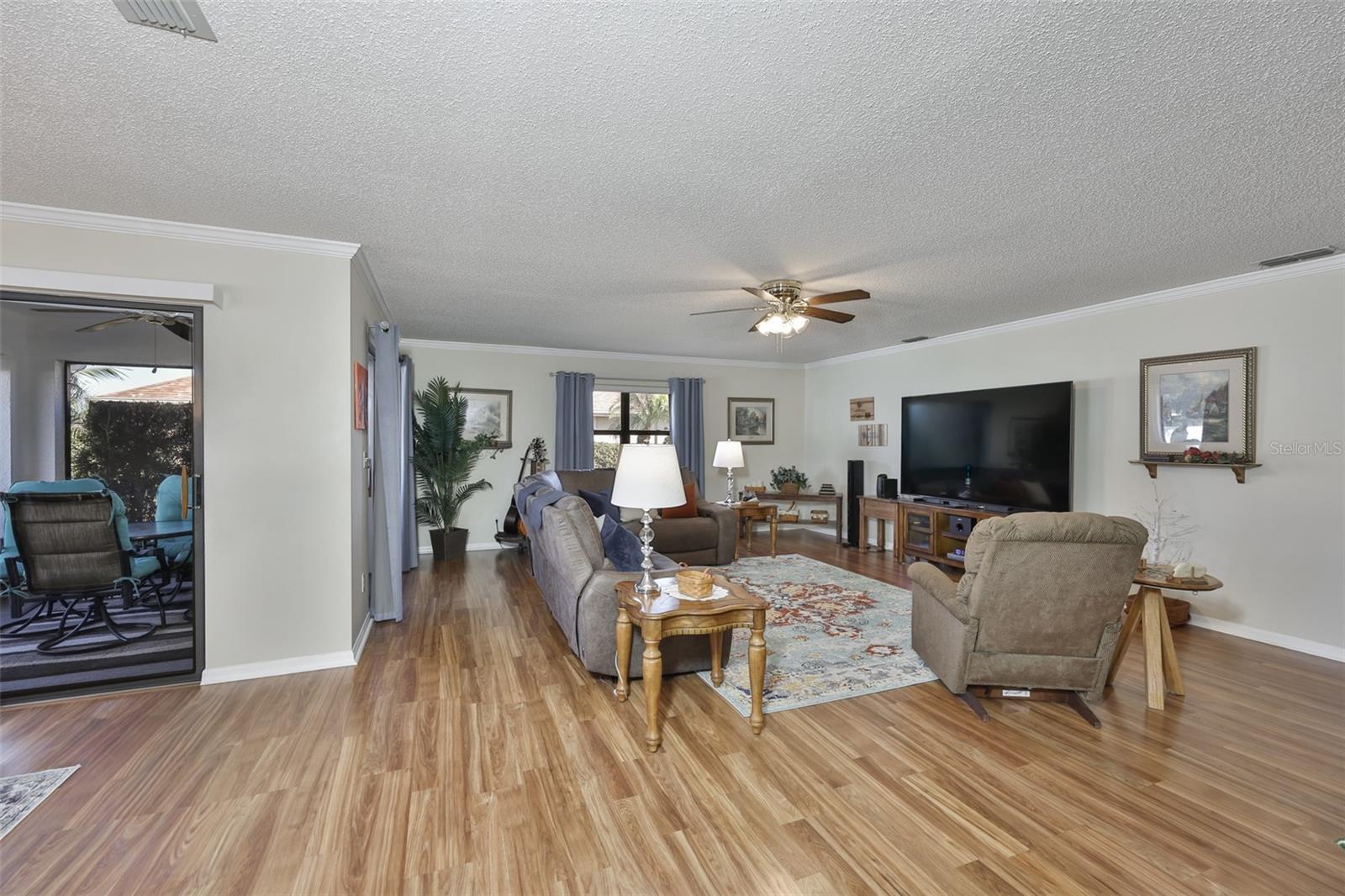 From the living room and dining room area, you have full access to the back screened patio.