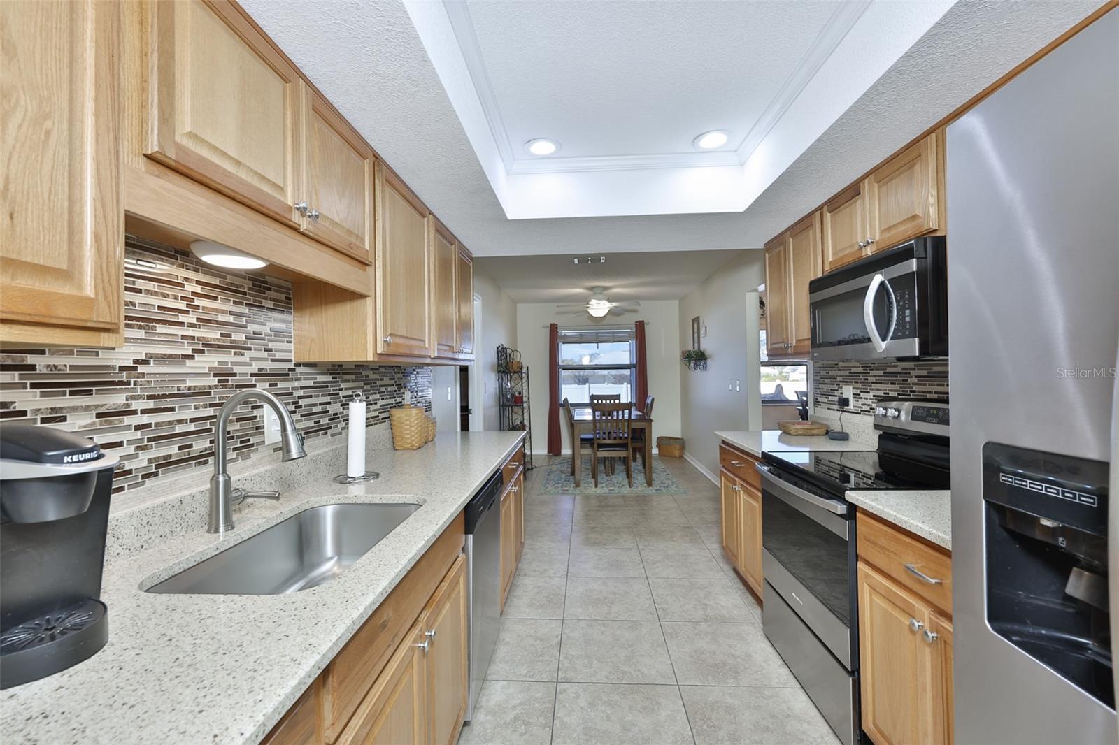 High-end Quartz counter tops with solid Oak cabinets, trey ceiling and recessed lights.