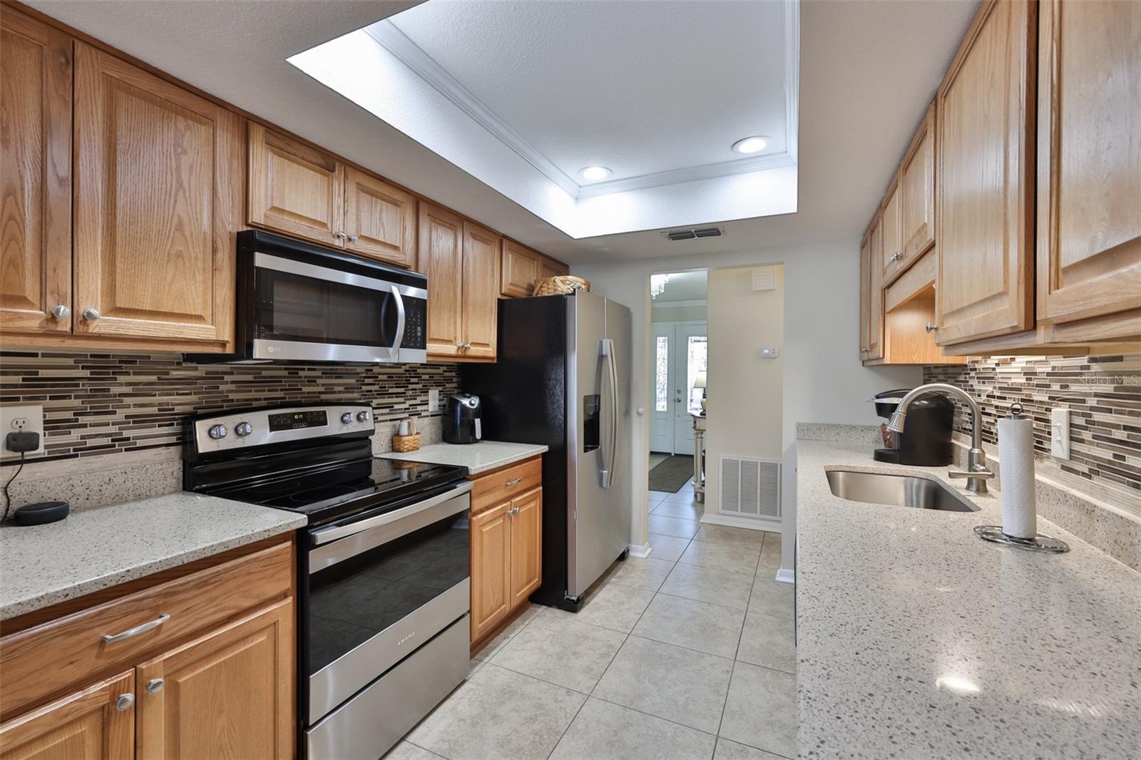 Sparkling clean and pristine, every inch of this kitchen has been thought through and enhanced for beauty and practicability.