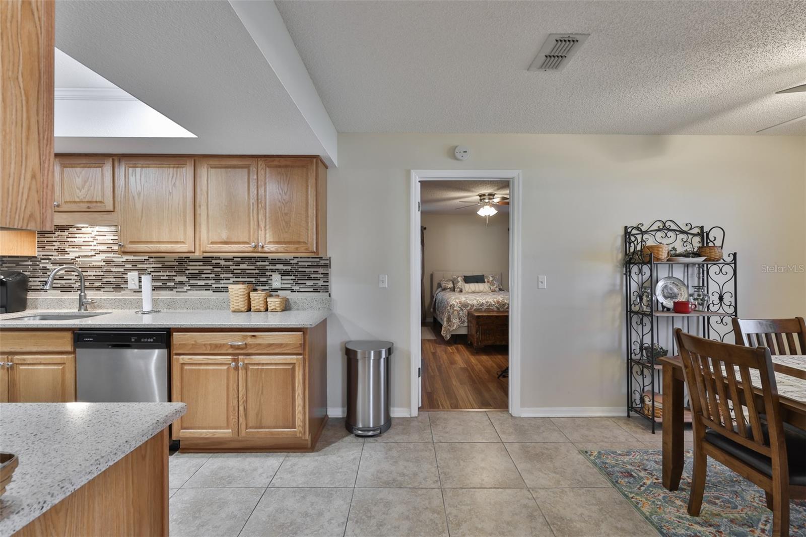 From the kitchen area, the primary ensuite bedroom is just off the main living area.
