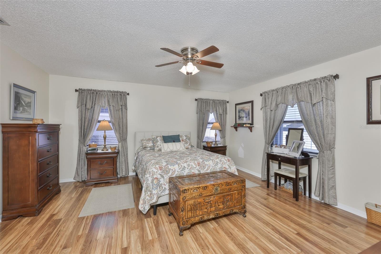 Notice the beautiful floors, large windows and spacious room.