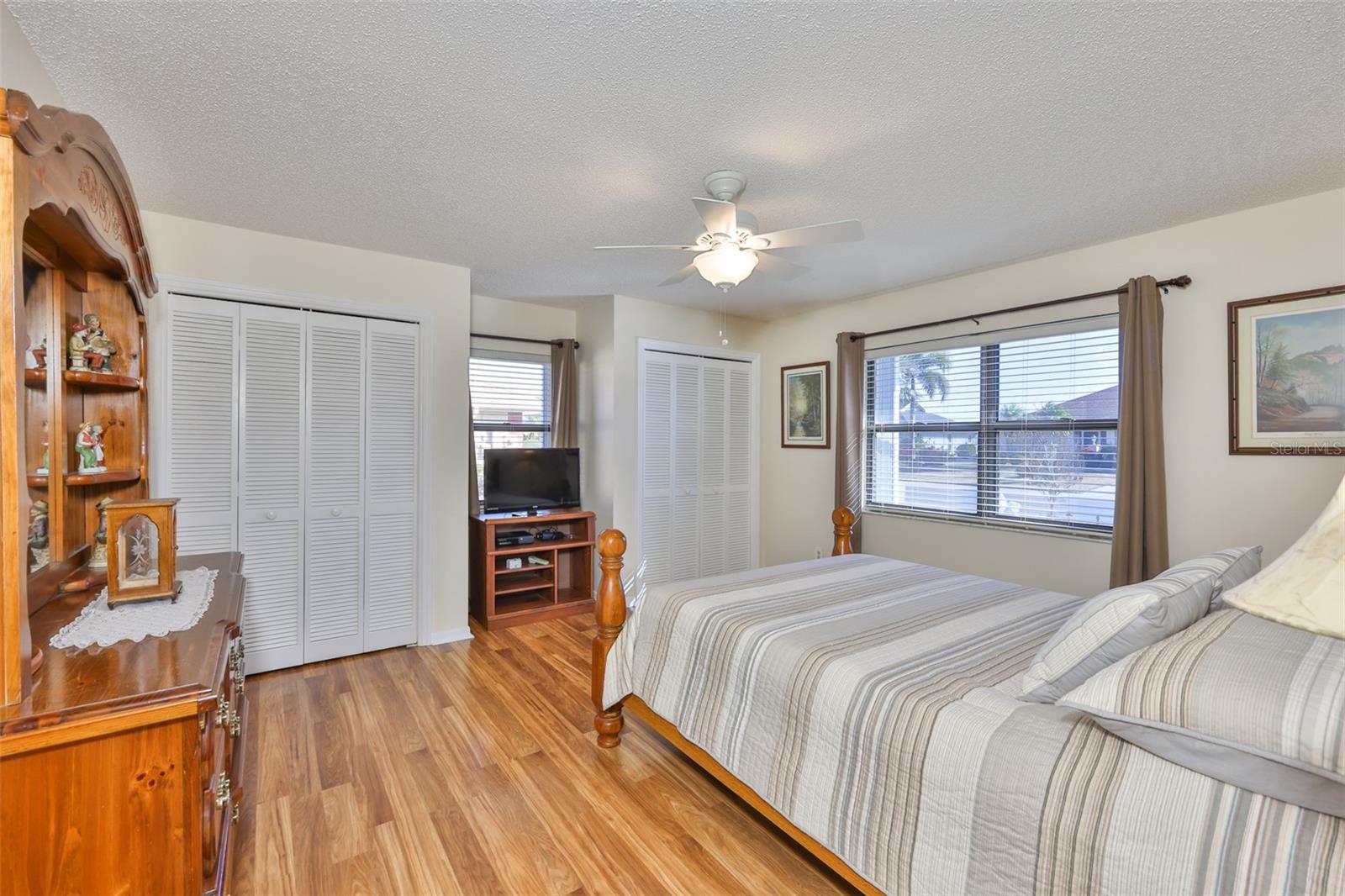 Bedroom #2 is large with two closets and continuous flooring, as in the rest of the home. Again multiple windows are perfect to make this home bright.
