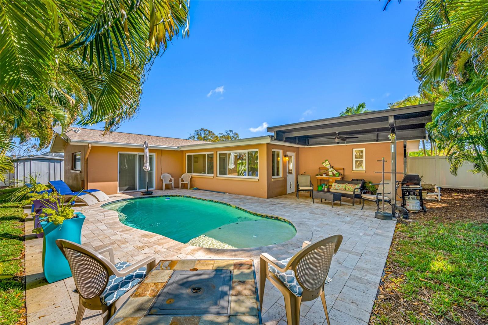 Inviting pool with pavers and covered lanai area