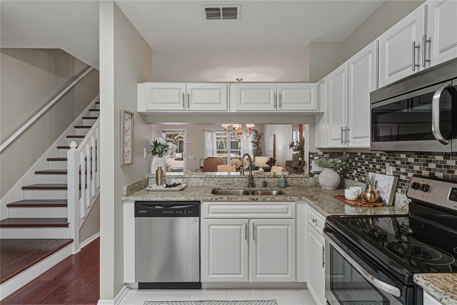 Remodeled Kitchen with Granite and Stainless Steel