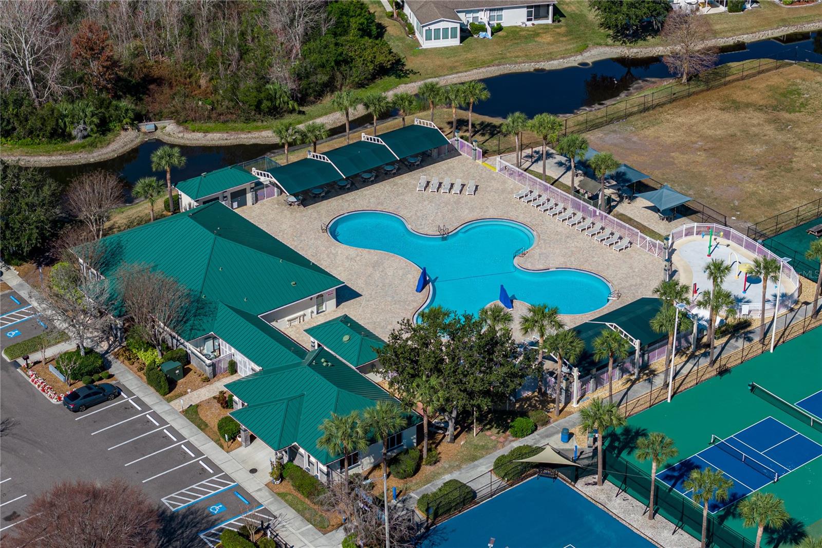 Community Pool & Waterpark with Covered Outdoor Seating and Louning Space