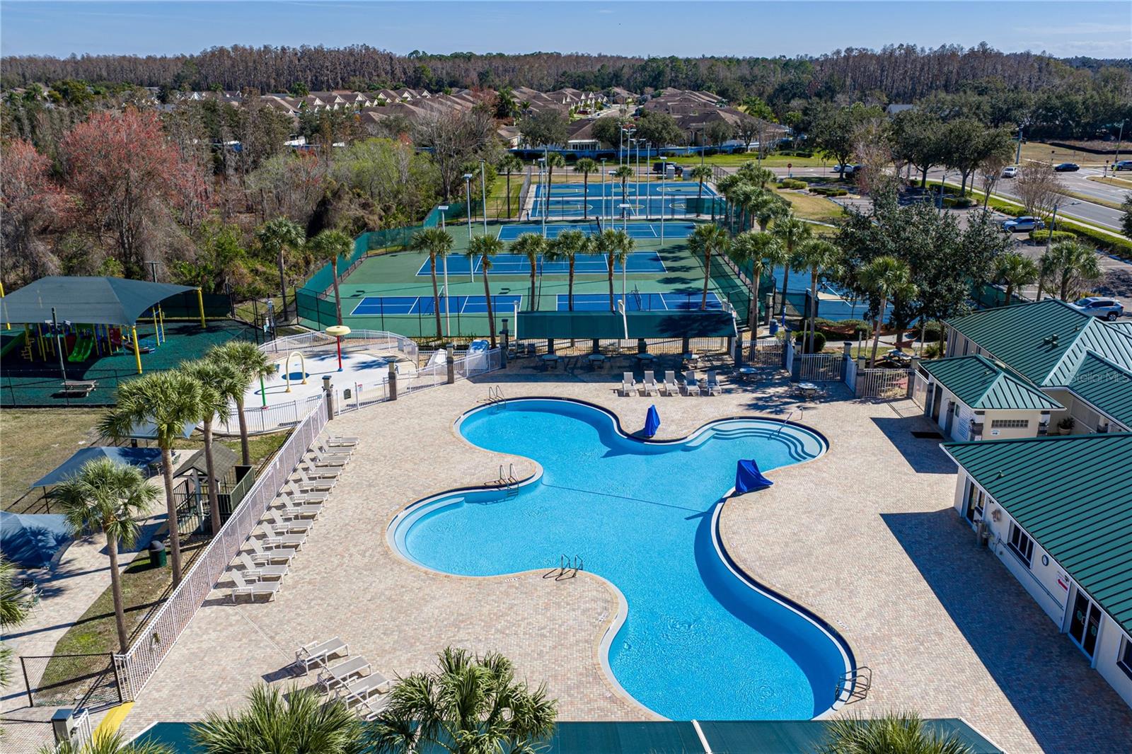 Community Pool & Waterpark with Covered Outdoor Seating and Louning Space