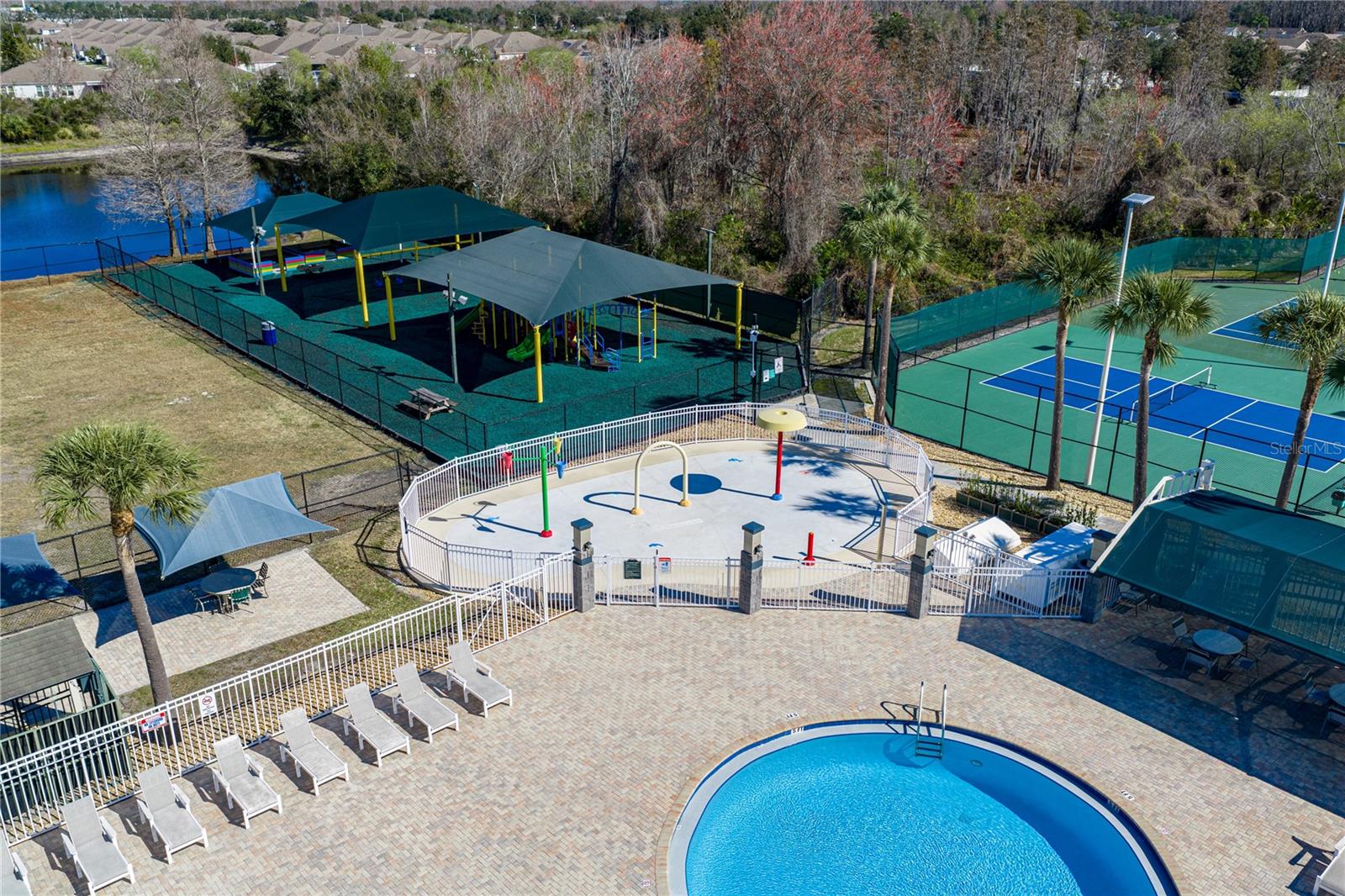 Community Pool & Waterpark with Covered Outdoor Seating and Louning Space