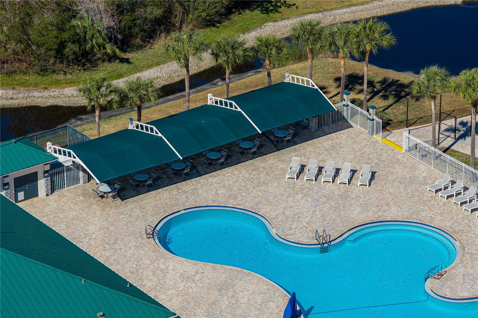 Community Pool & Waterpark with Covered Outdoor Seating and Louning Space