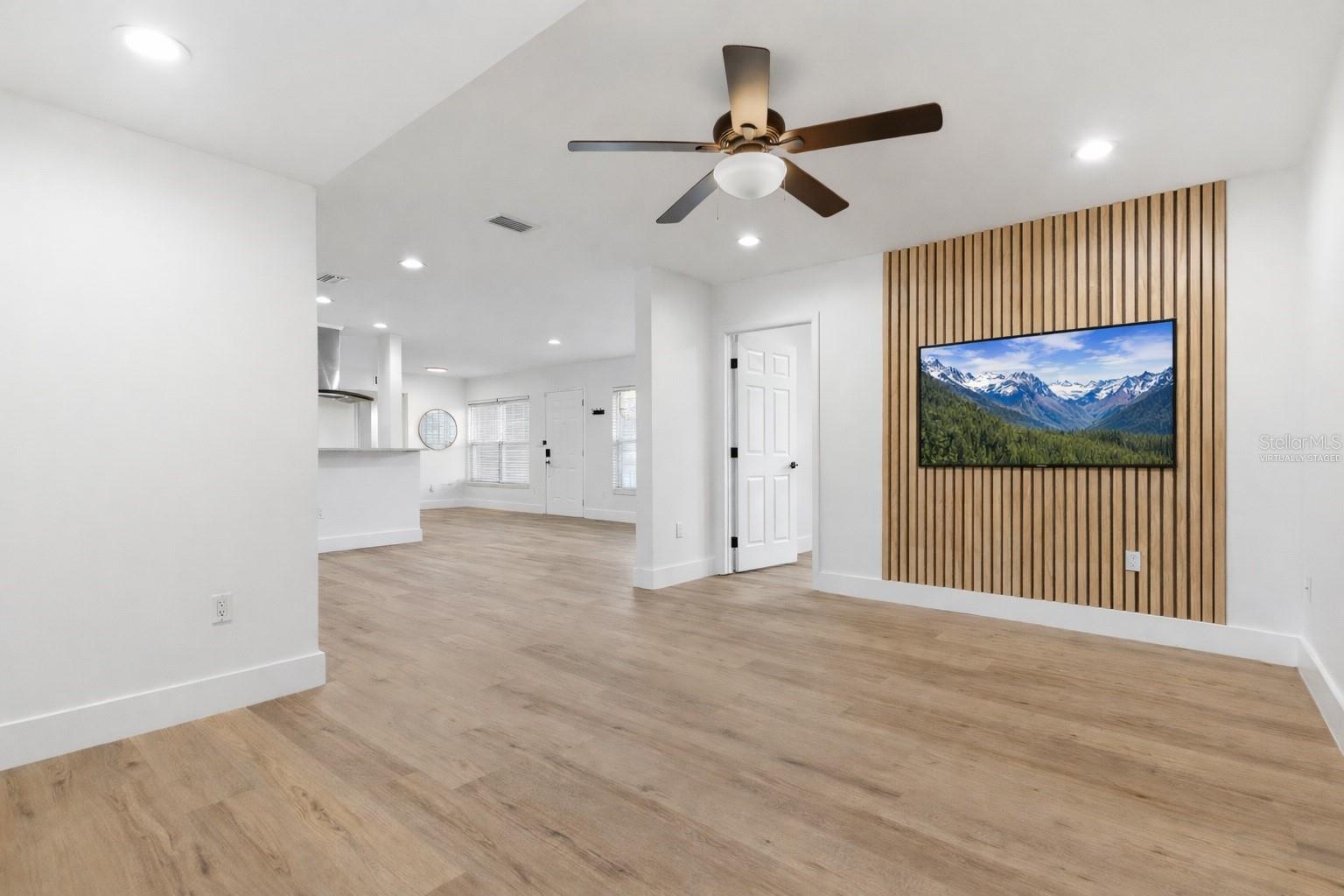 Virtually staged TV. TV wall mount installed and conveys