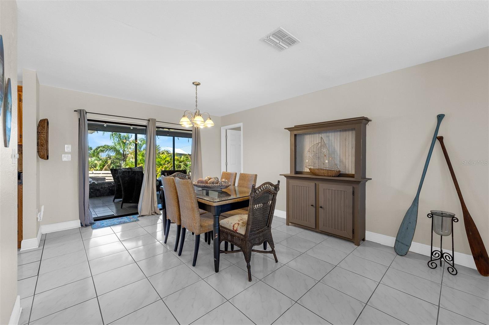 Dining area 12'3" X 18'2"  Sliders onto large screened lanai and open pool deck