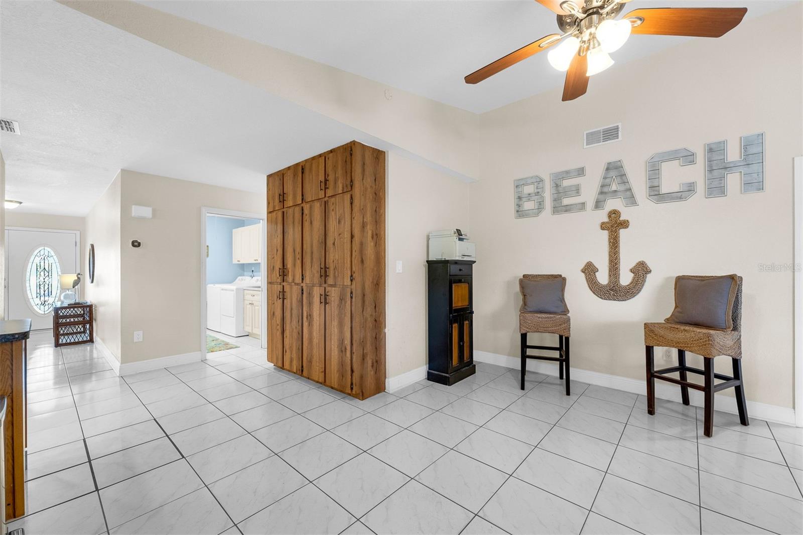 Family room area. Additional 3 bedrooms and 2 1/2 baths on this side of the house. Cathedral ceilings and ceiling fans.  Plenty of storage.