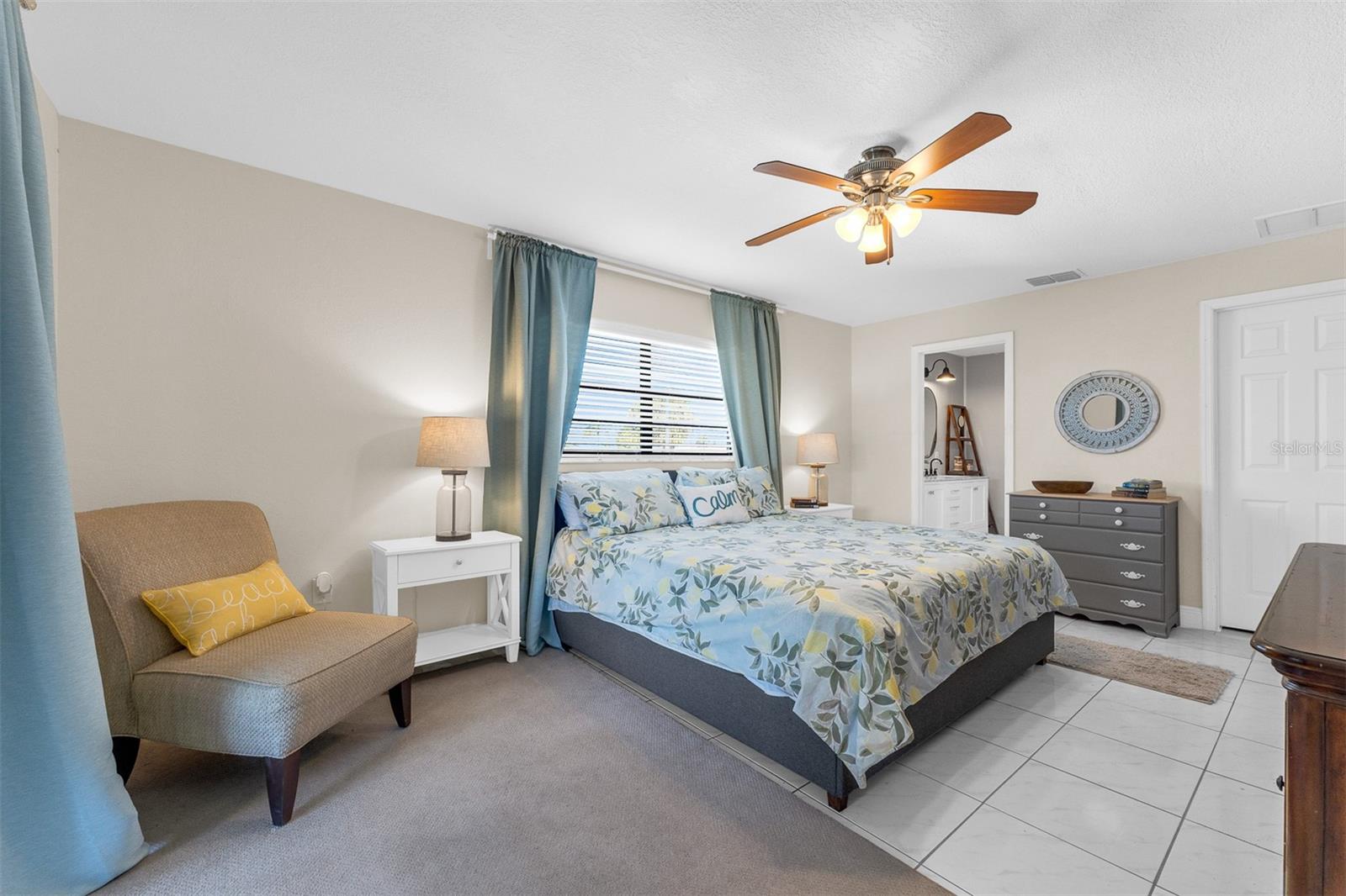 Master or primary bedroom  12'1" X 18'2"  Large walk-in closet, Sliders onto screened in lanai. Looking twards the master bathroom ( bathroom #1 )