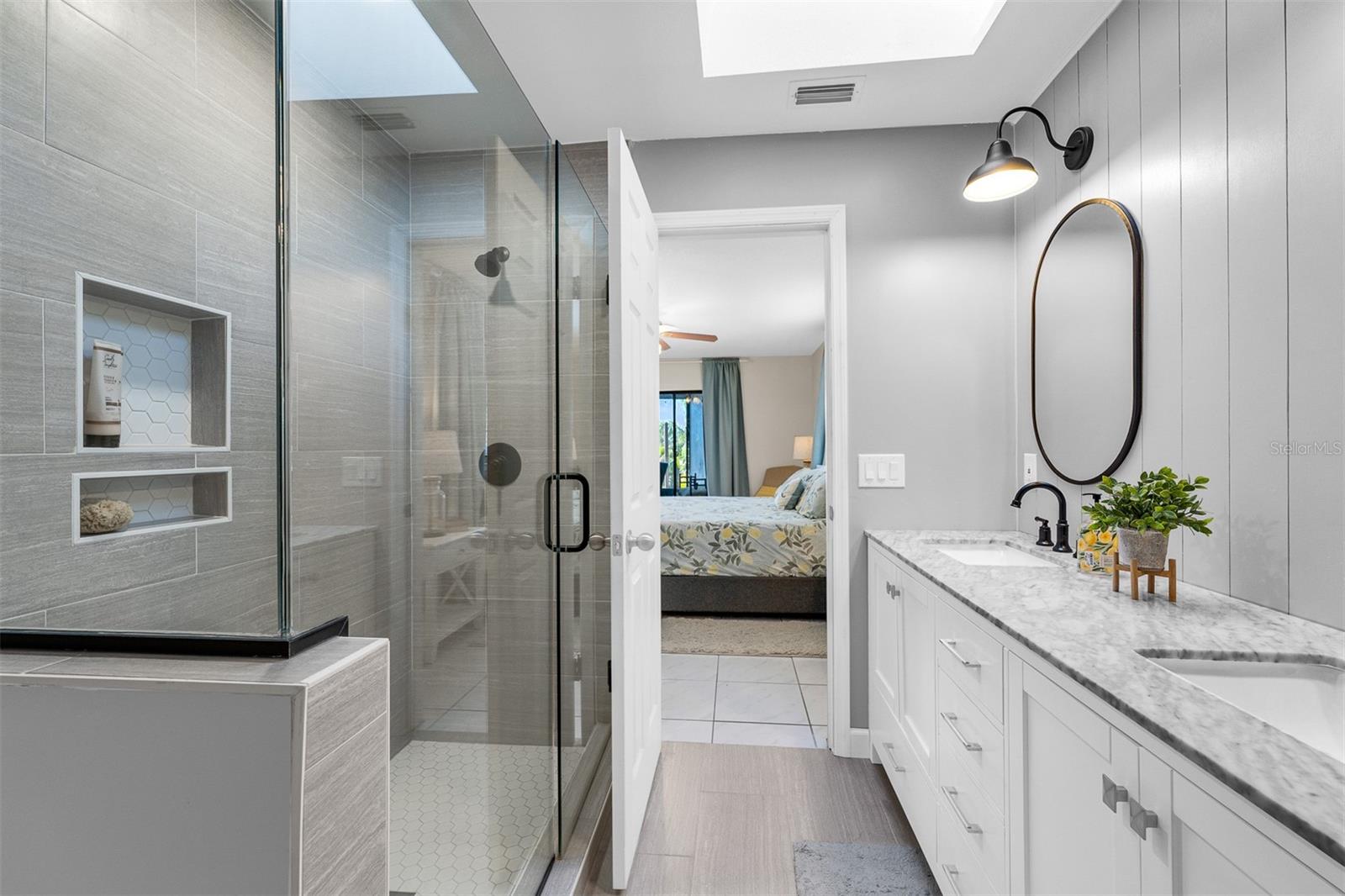 Glass shower doors. Tile flooring and spacious.