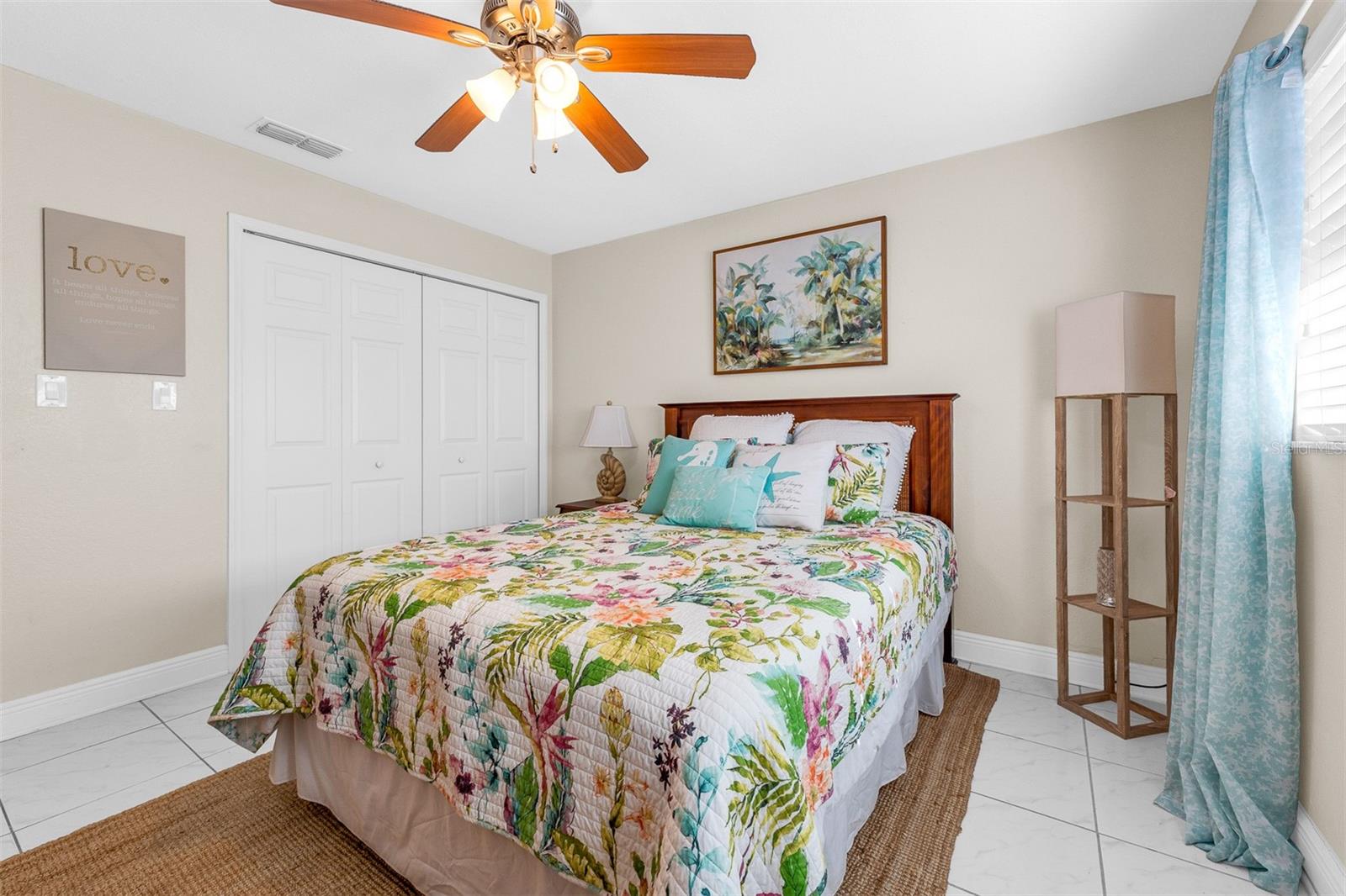 High ceilings, ceiling fan and large closet. Bedroom #2
