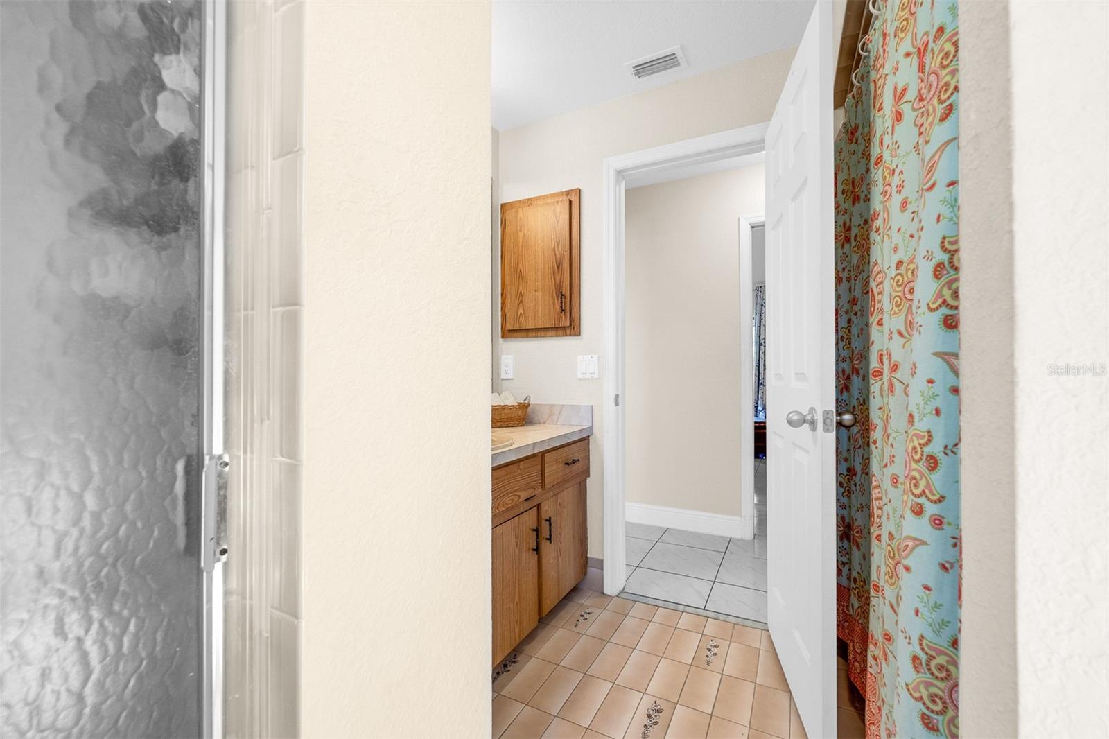 Looking out of bathroom #3 into hallway between bedroom #3 and #4.  Hallway measures 3'2" X 10'9"