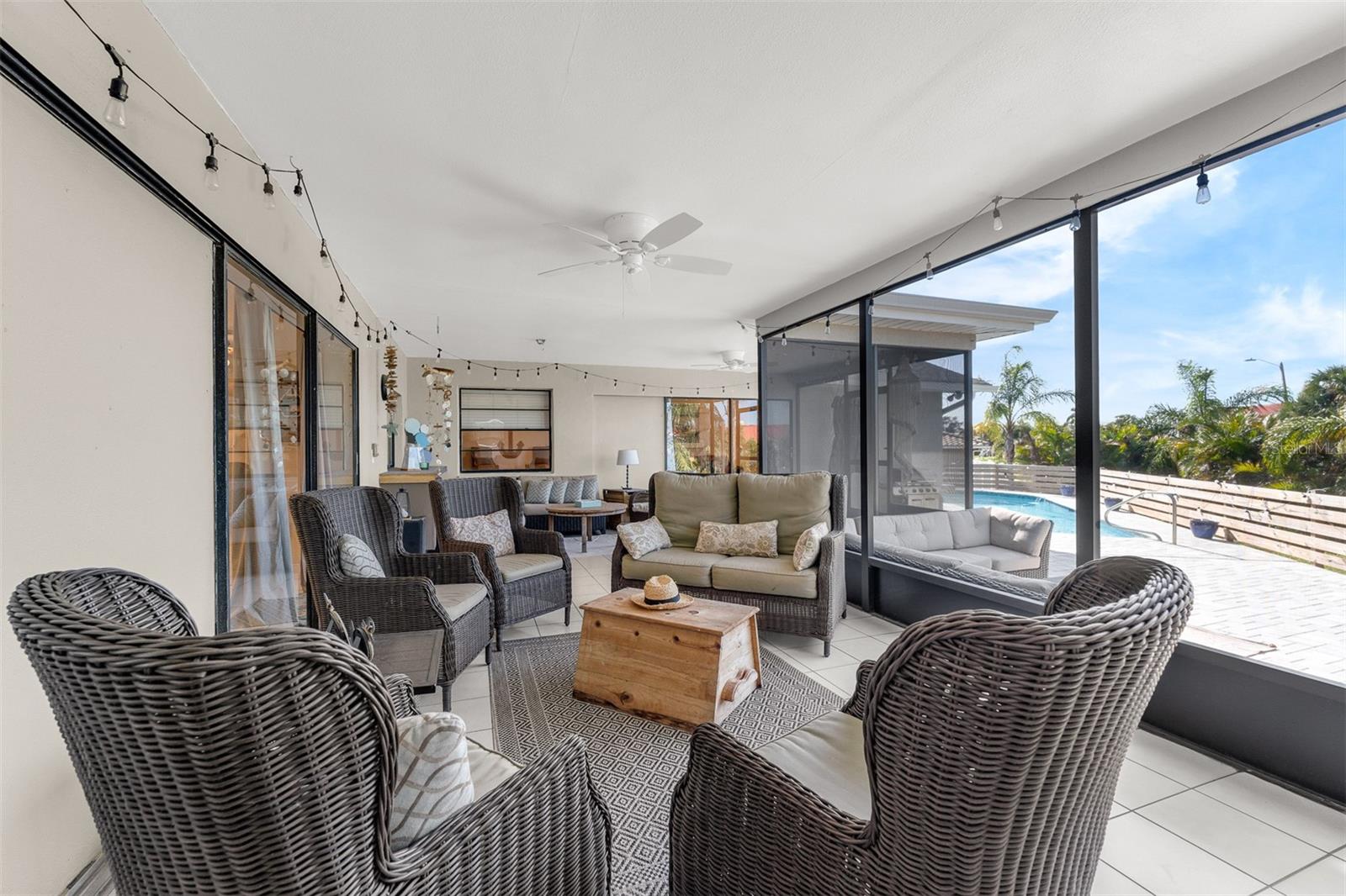 View from primary bedroom to family room and outside pool deck.