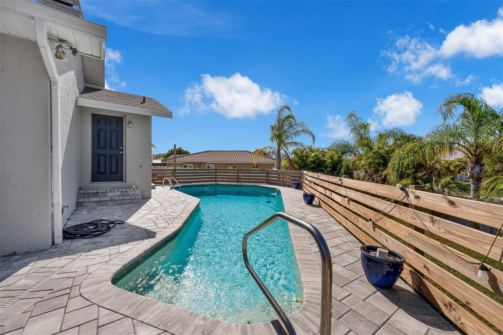 Open air pool. 6 ft in depth. Door pictured is pool bath.