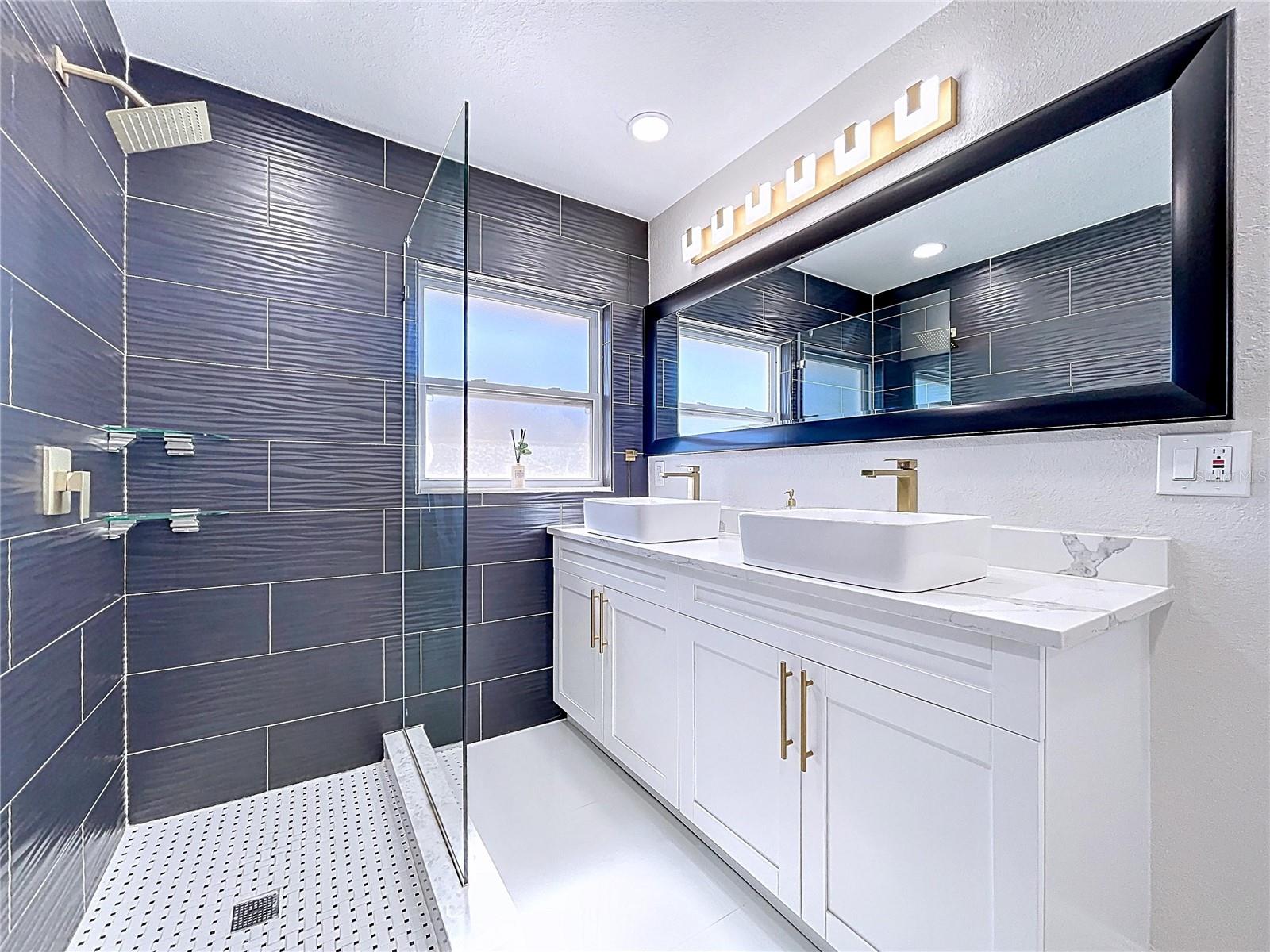 Double vanity w/ vessel sinks, gold modern fixtures &updated LED lighting