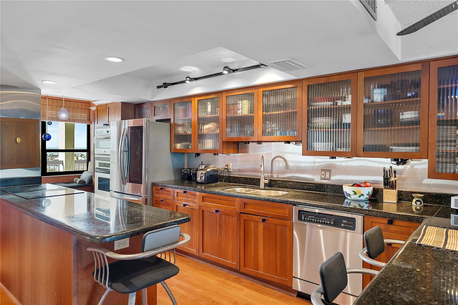 Enjoy the completely open updated full kitchen with generous counter space, convection oven, solid wood cabinets and with all soft close full feature and watch the sunset over the Gulf from your private day bed!