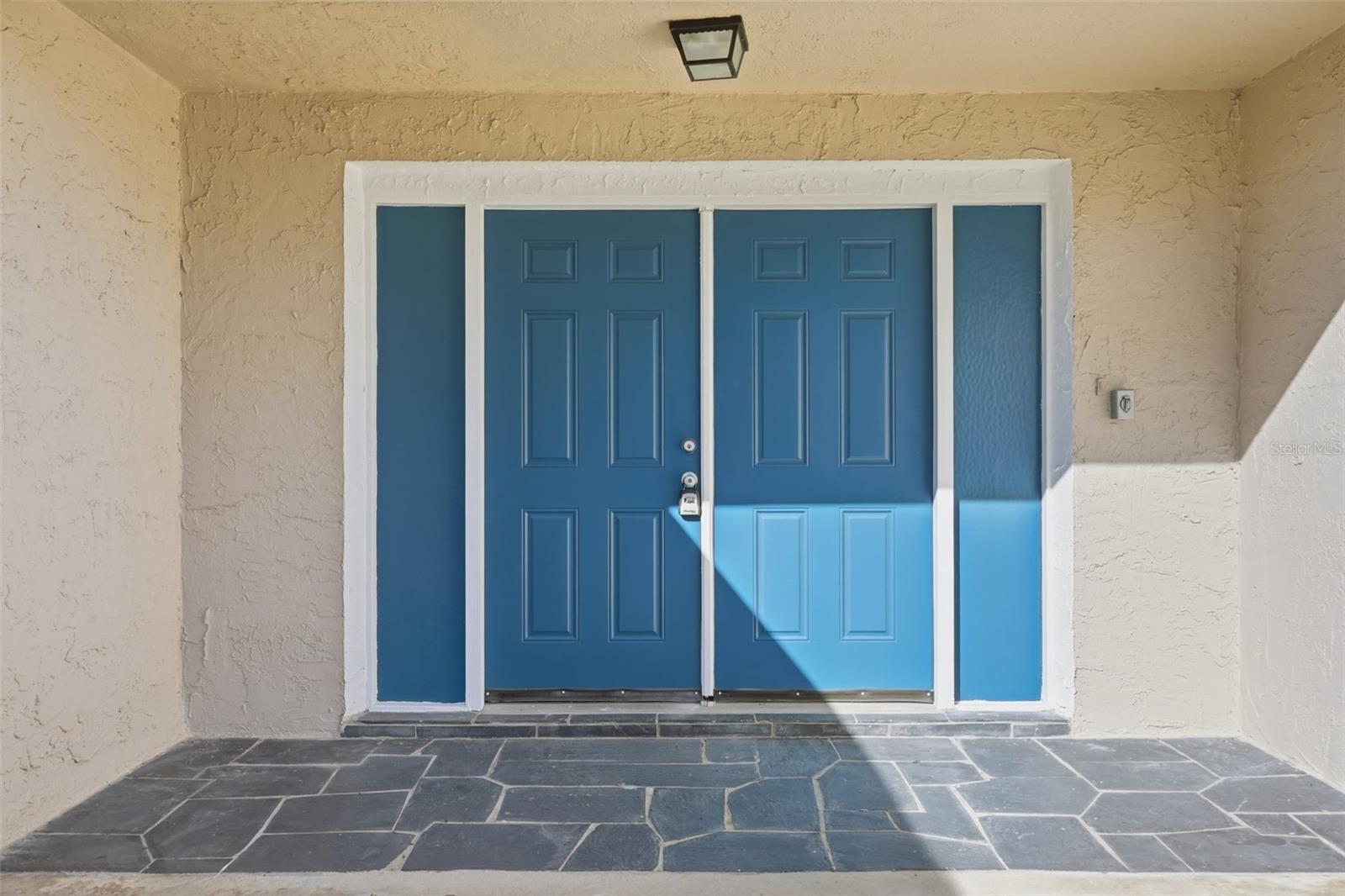 DOUBLE FRONT DOOR AND PORCH