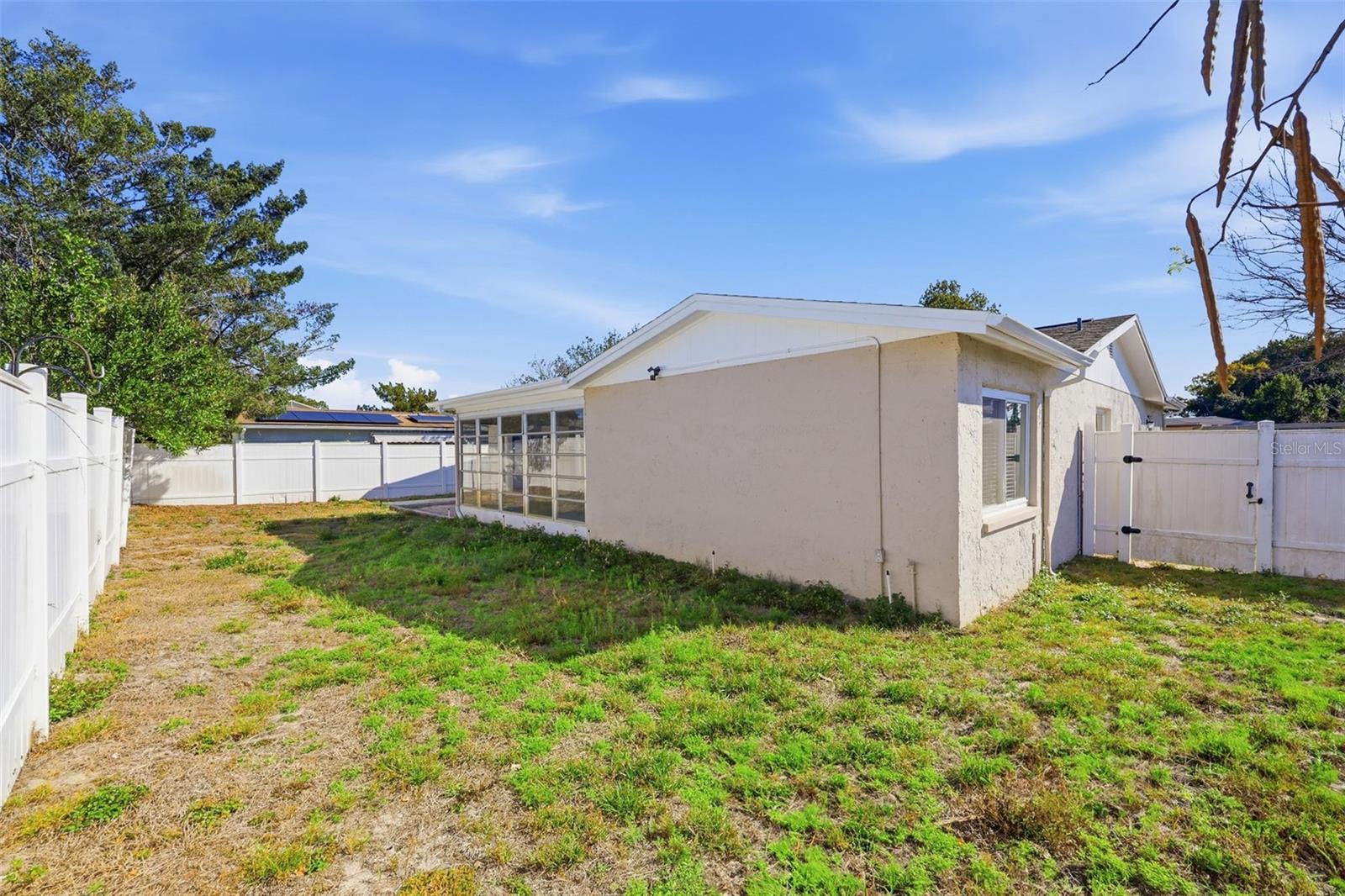 BACK OF THE HOUSE AND BACK YARD