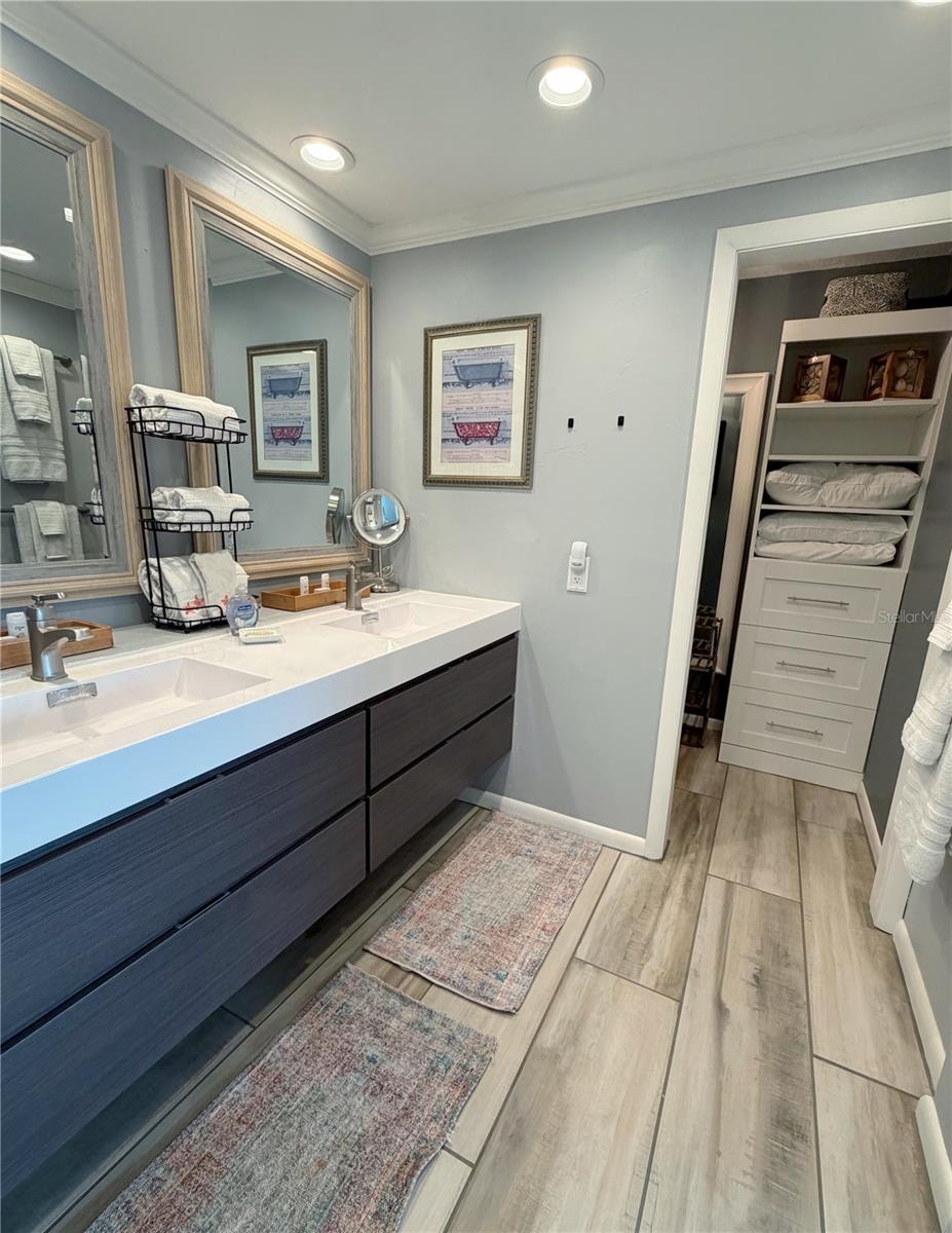 Walk in closet in the primary bathroom.