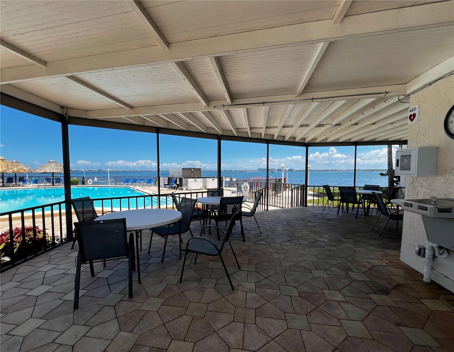 Shaded pavilion attached to the community room and pool.
