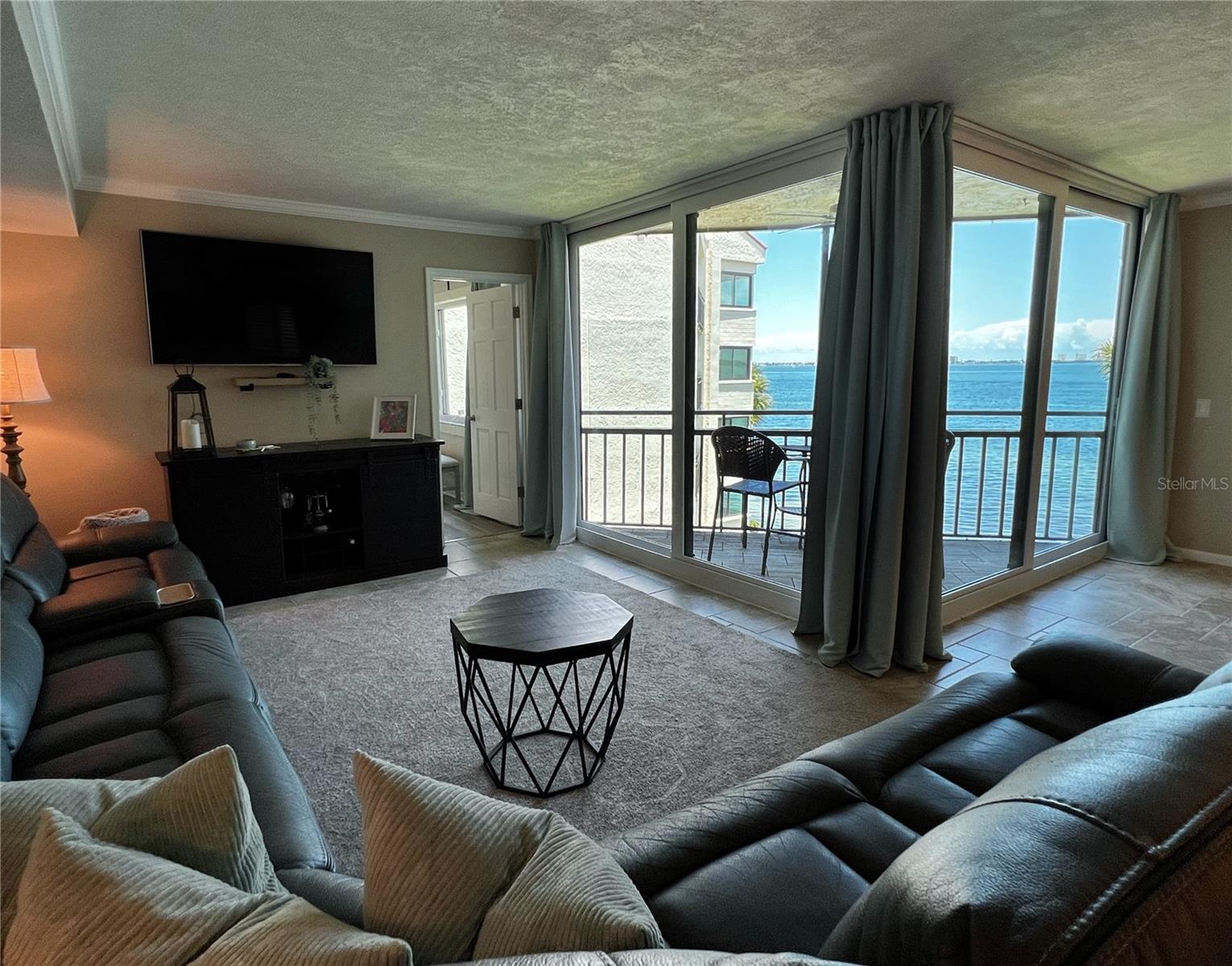 Welcome in! You are greeted by the open concept living and dining rooms and the waterfront view.