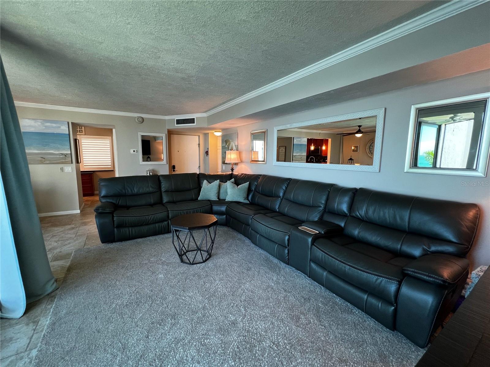 Another view of the living room looking towards the front entrance door.