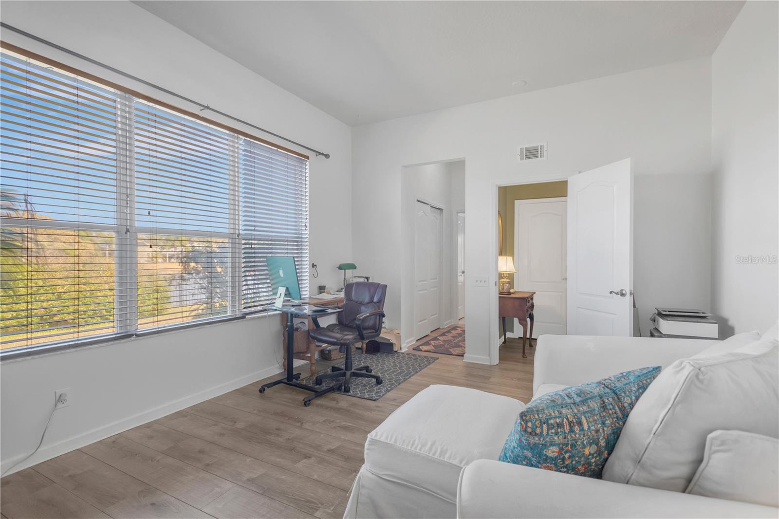 bedroom #4 has direct views of Lake Fern and a full bathroom off the hallway.