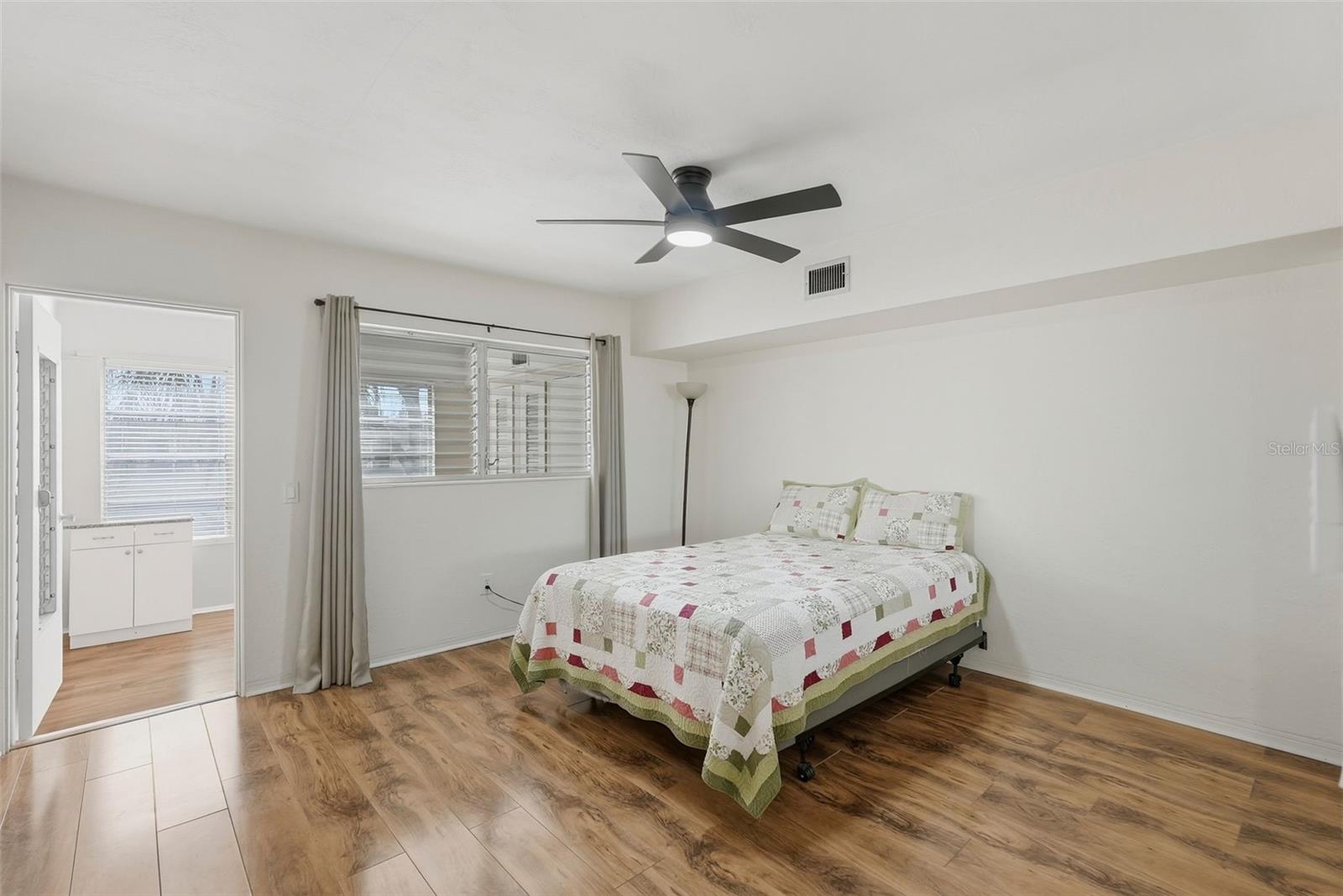 Large bedroom gets the natural light from both sides