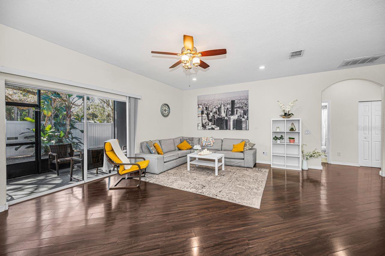 Living room open onto screened-in patio