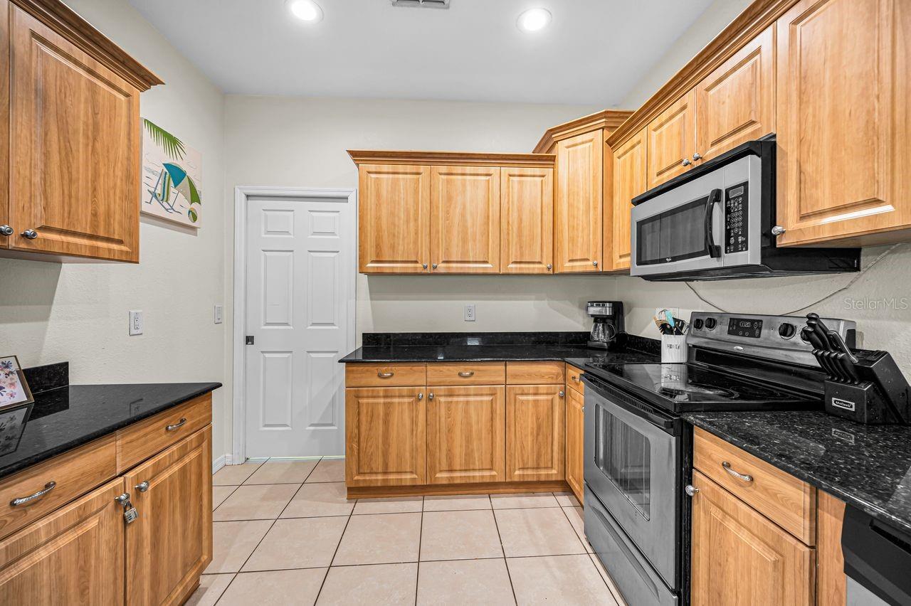 Doorway leads to laundry and 2 car garage