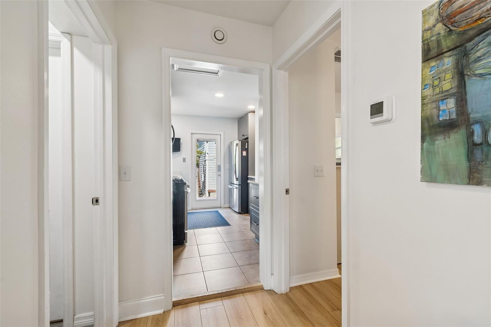 Entrance to the master on the right, kitchen in center and laundry/guest bath on left