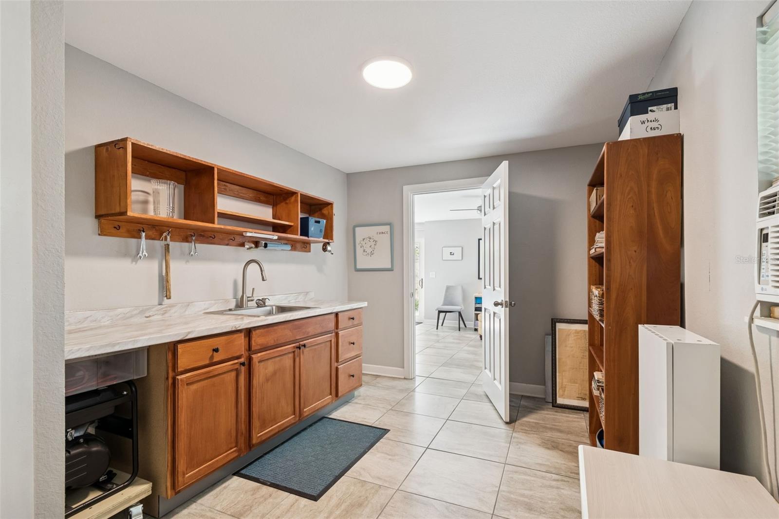 View of kitchen. Door is to the sitting area.