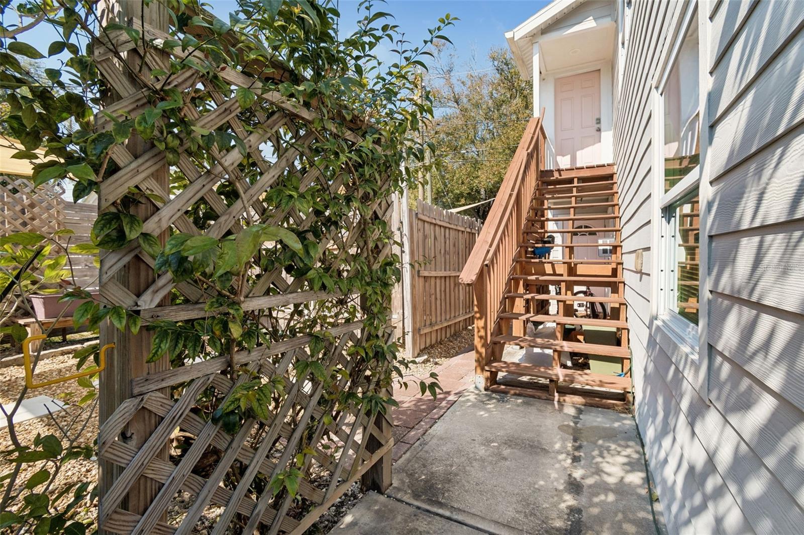 View of walkway to upstairs unit steps