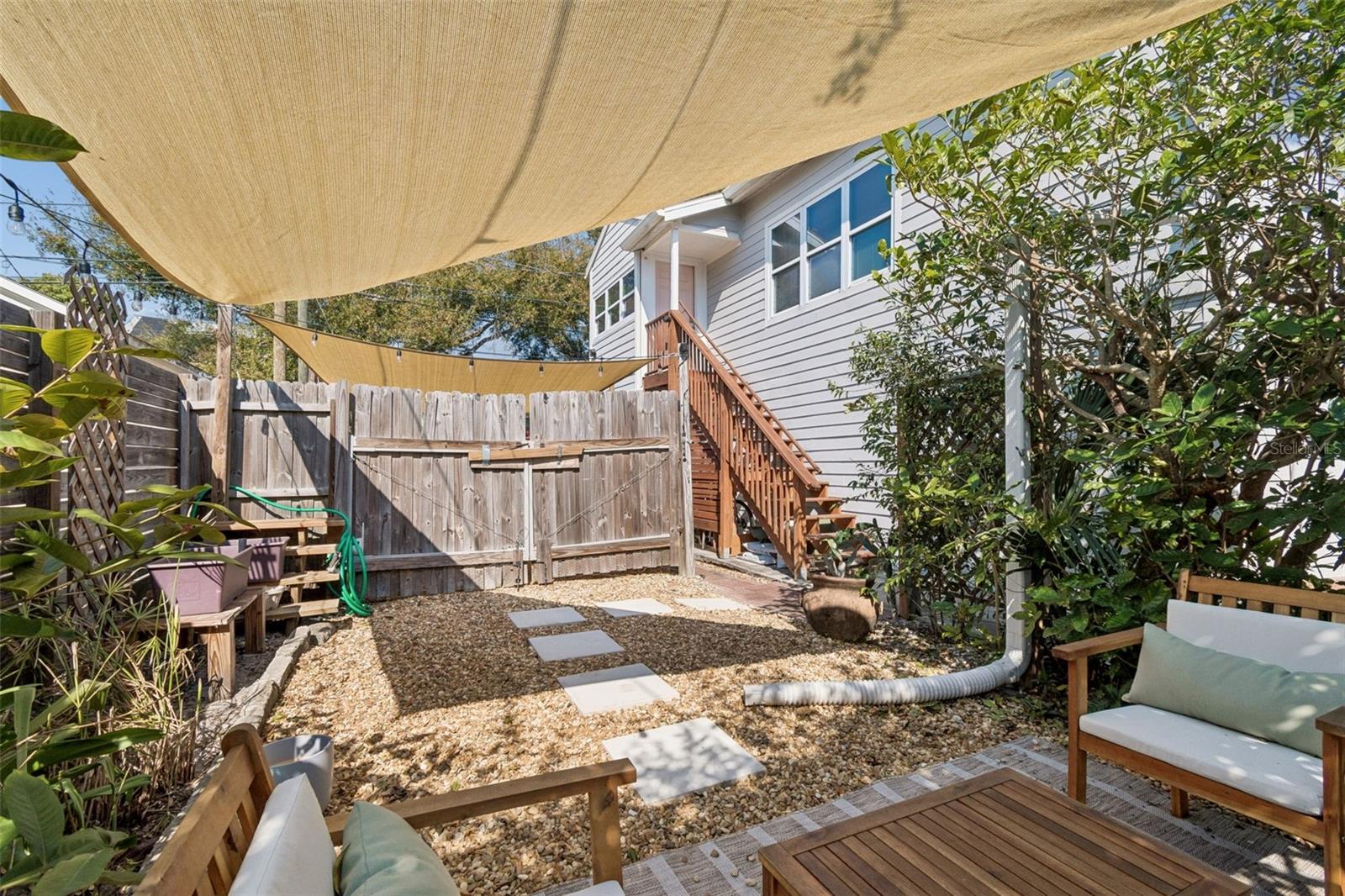 View from the patio. Parking space is behind the wooden gate.