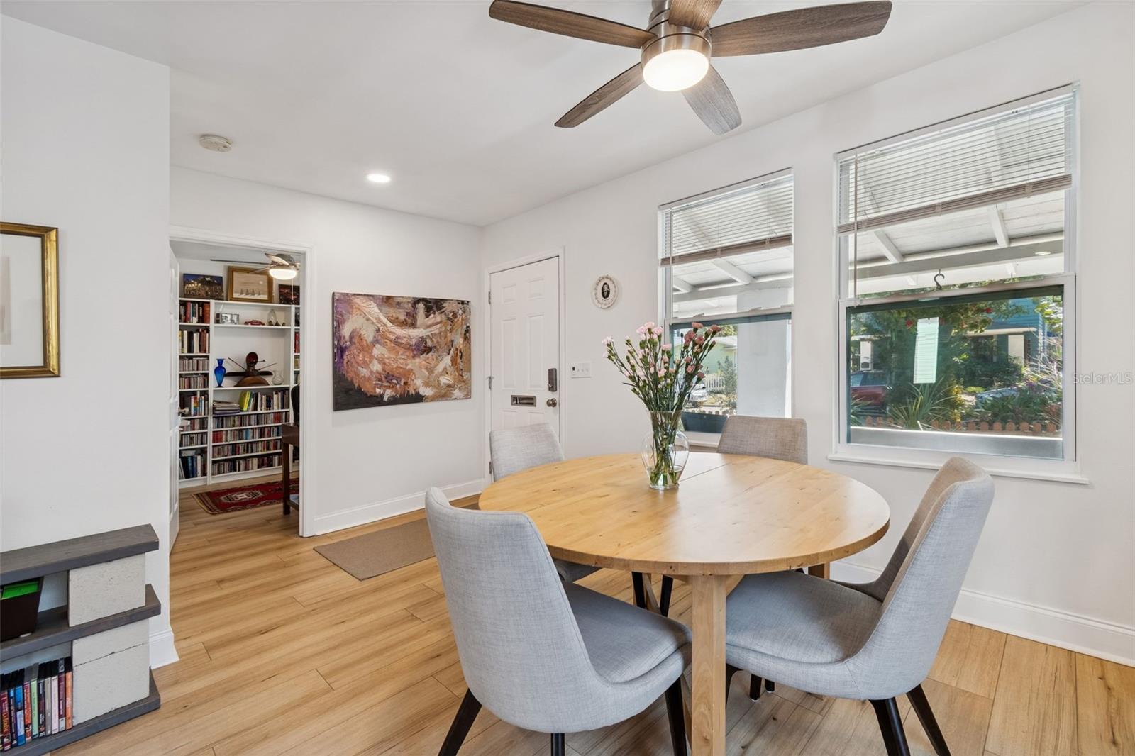 View of dining area w/ front door and door to front bedroom