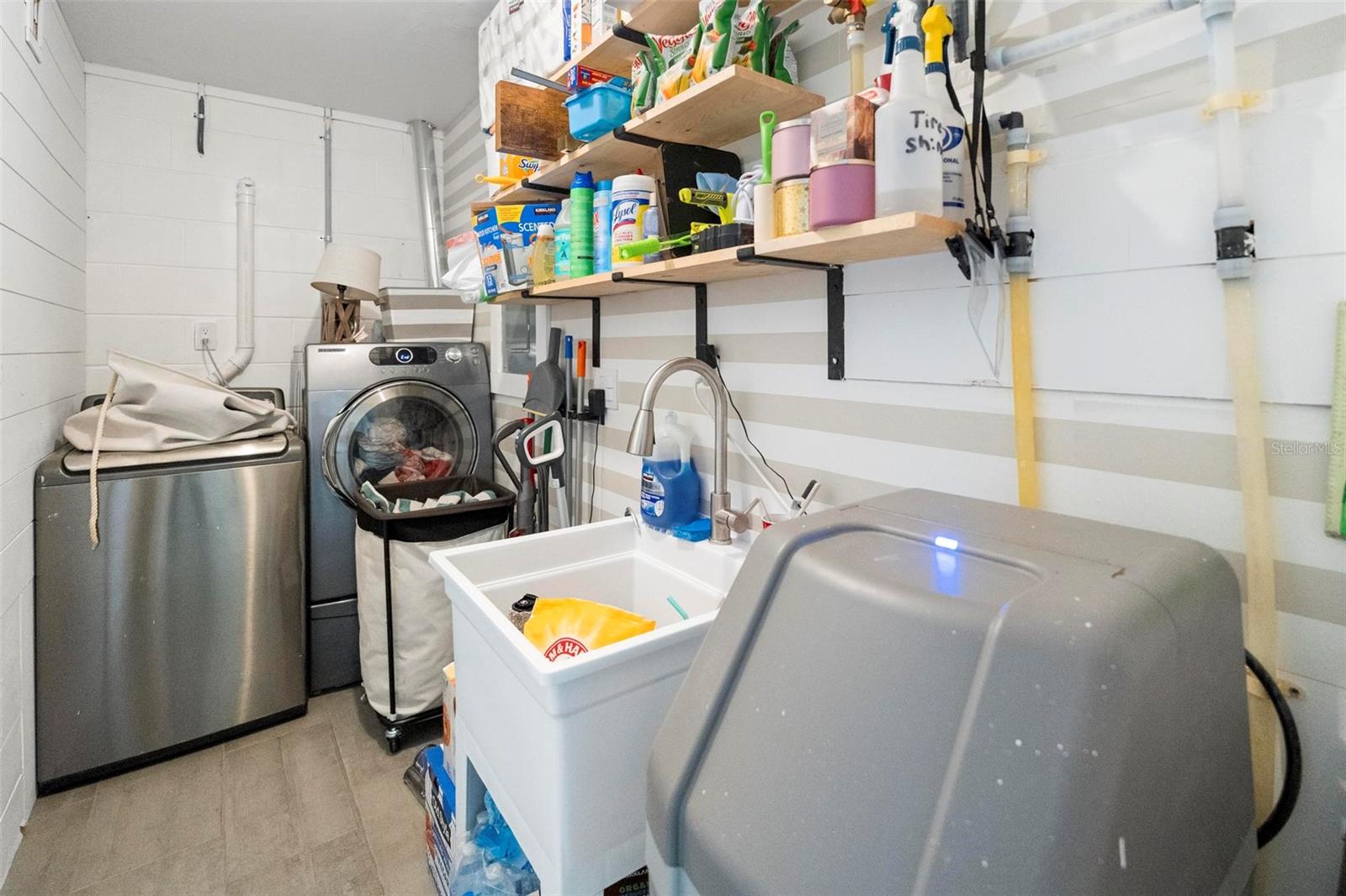 Indoor Laundry with utility sink and water softener system