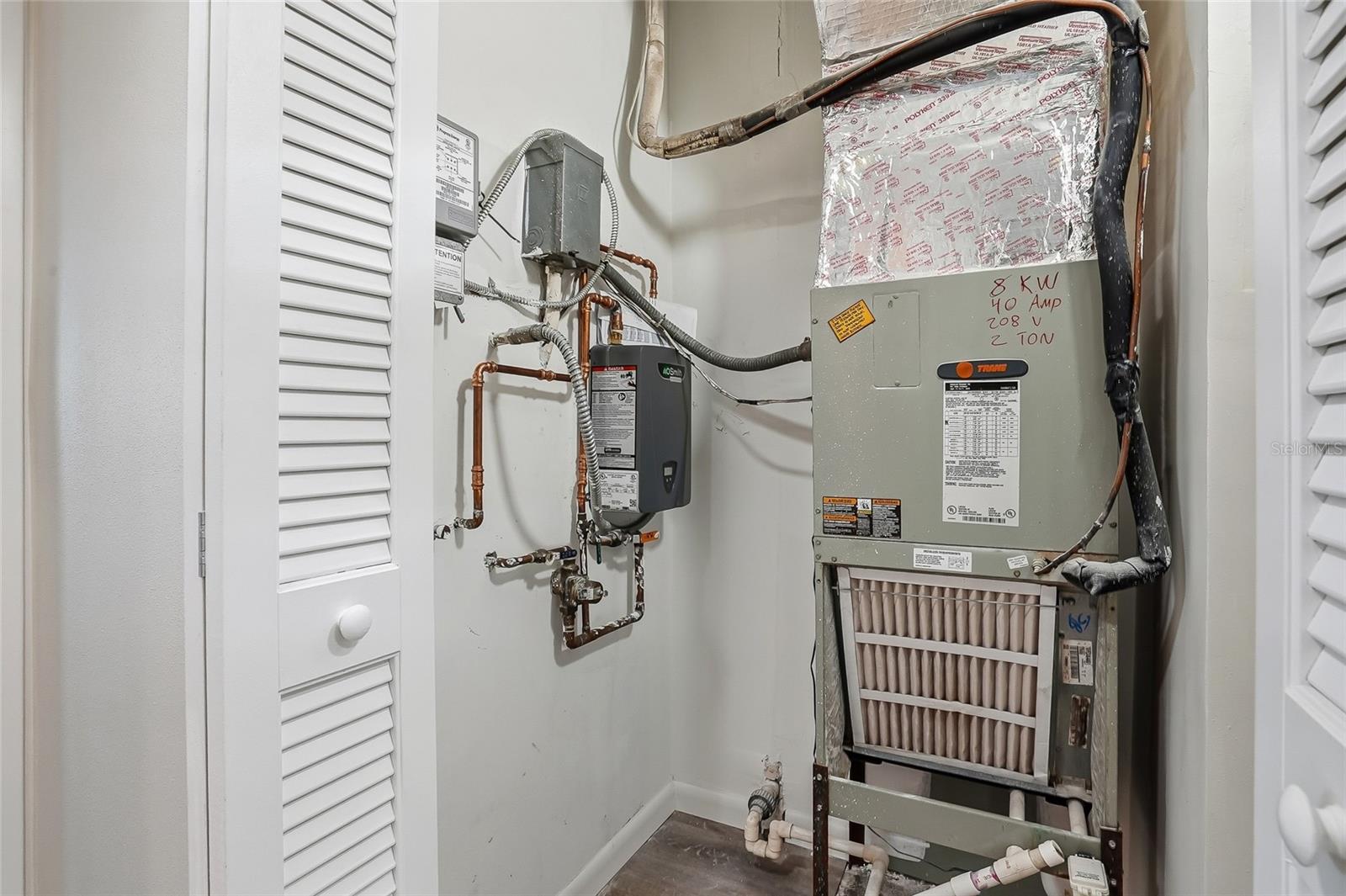 Tankless water heater saves room in the utility closet.