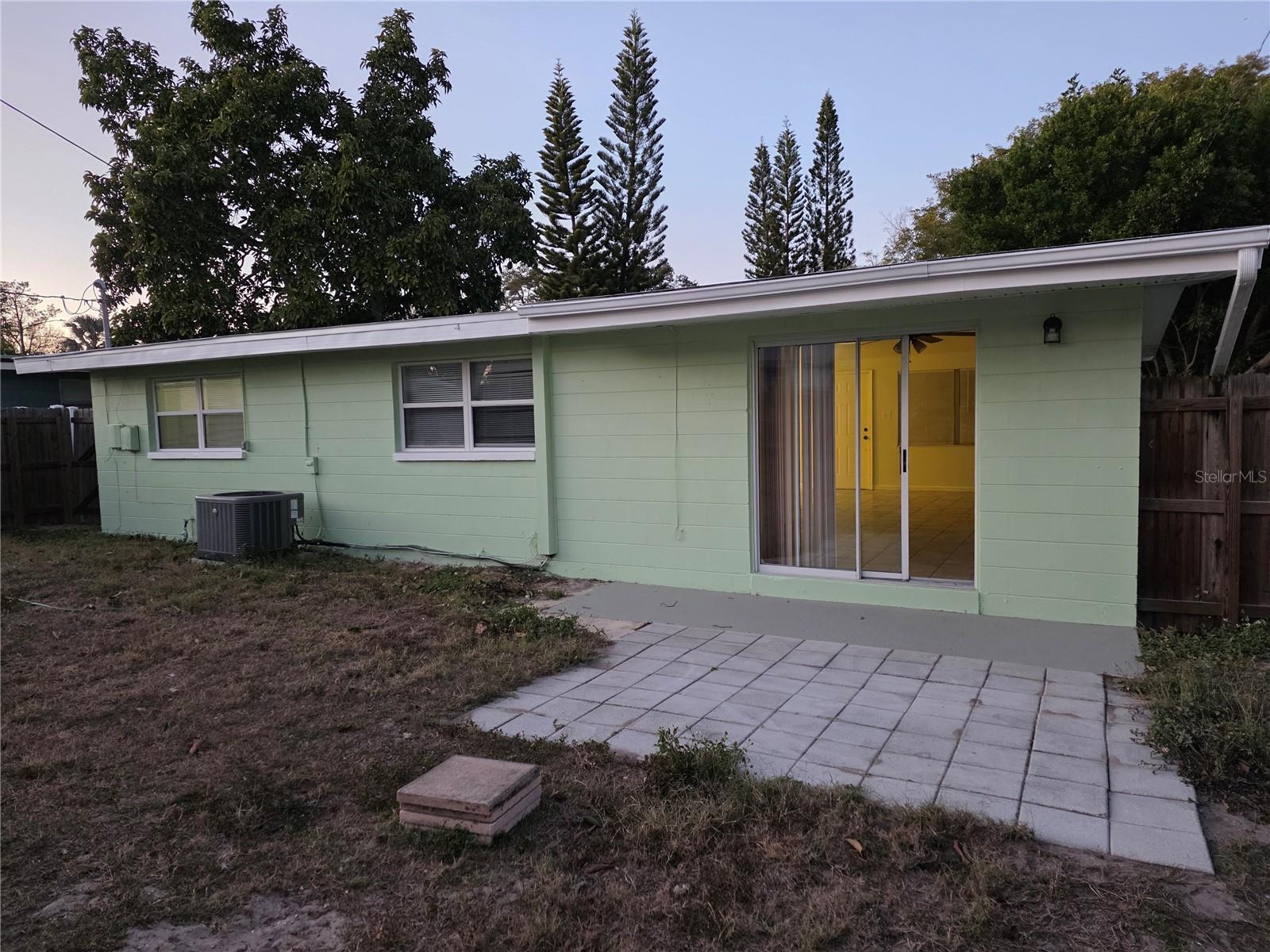 Back of home has patio space - fenced yard