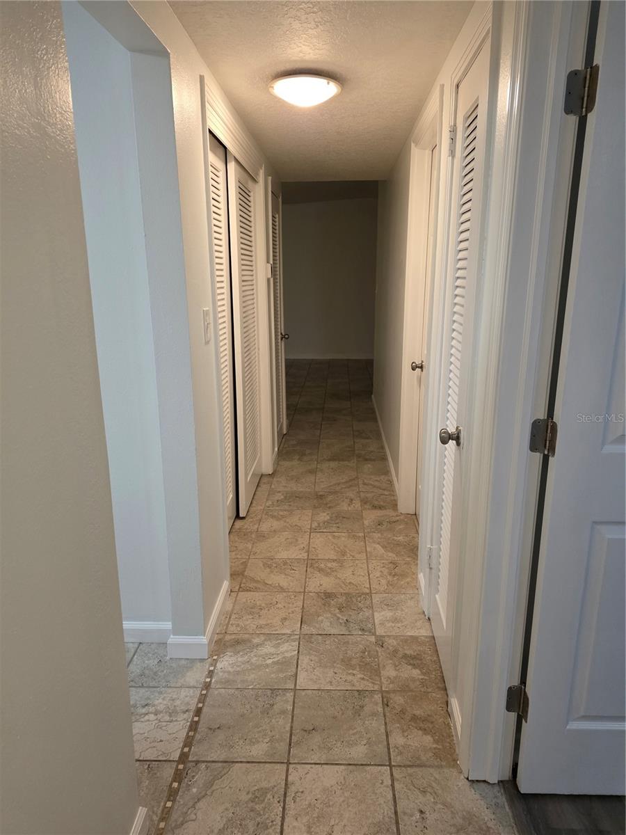 Hallway separates living space from bedrooms