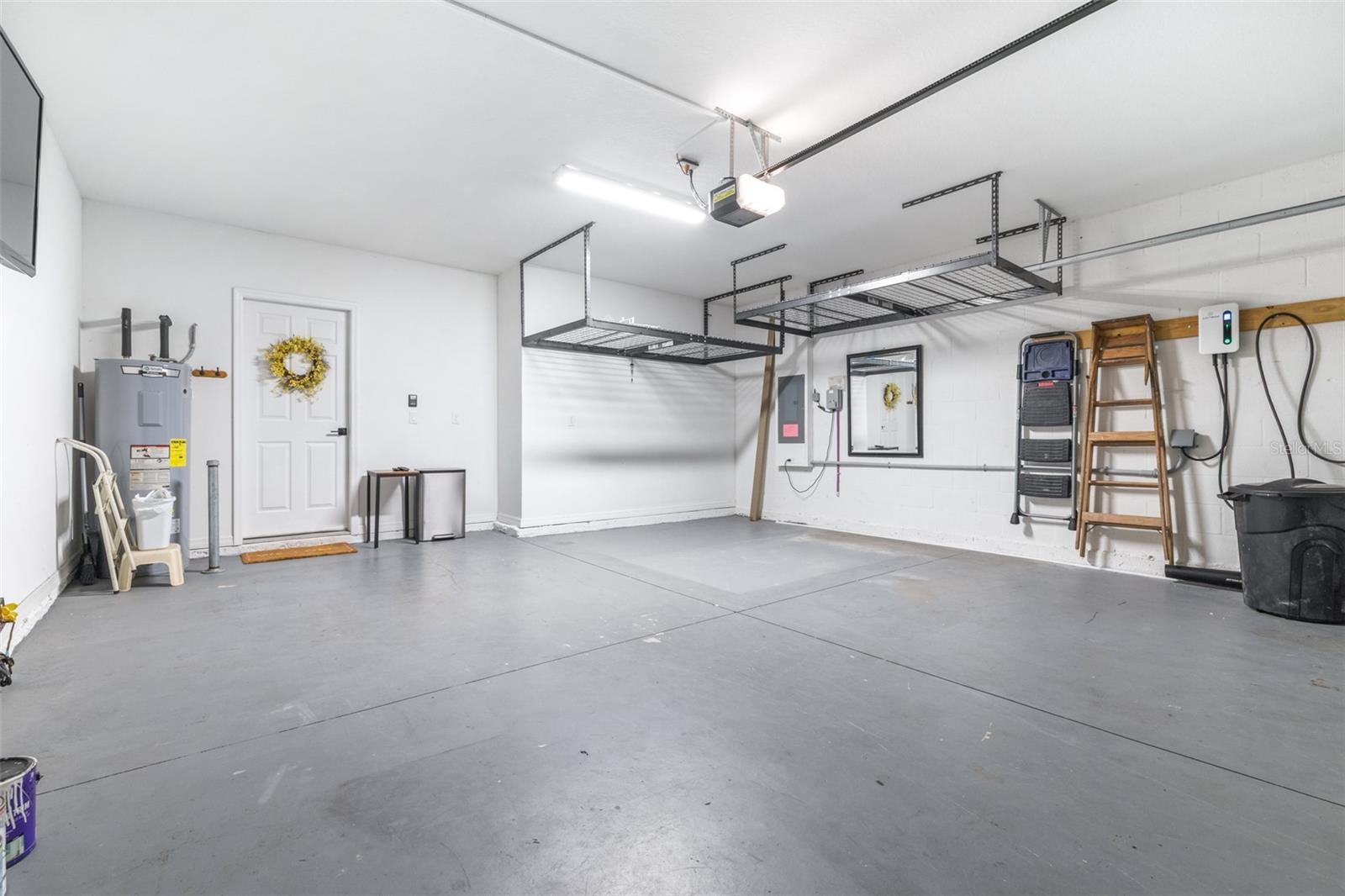 Garage with hanging storage and built in EV Hook up