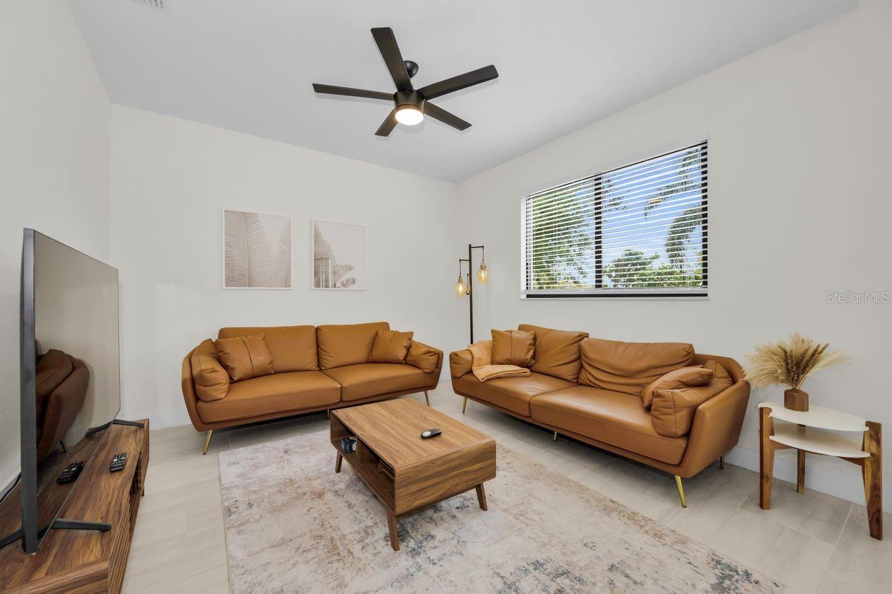 Spacious living room with plenty of natural light.