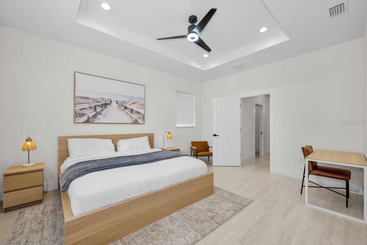 A gorgeous primary bedroom with simple and clean lines.