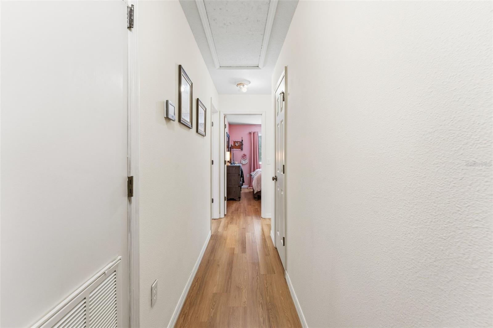 Hallway into bedrooms 2/3 and guest bathroom