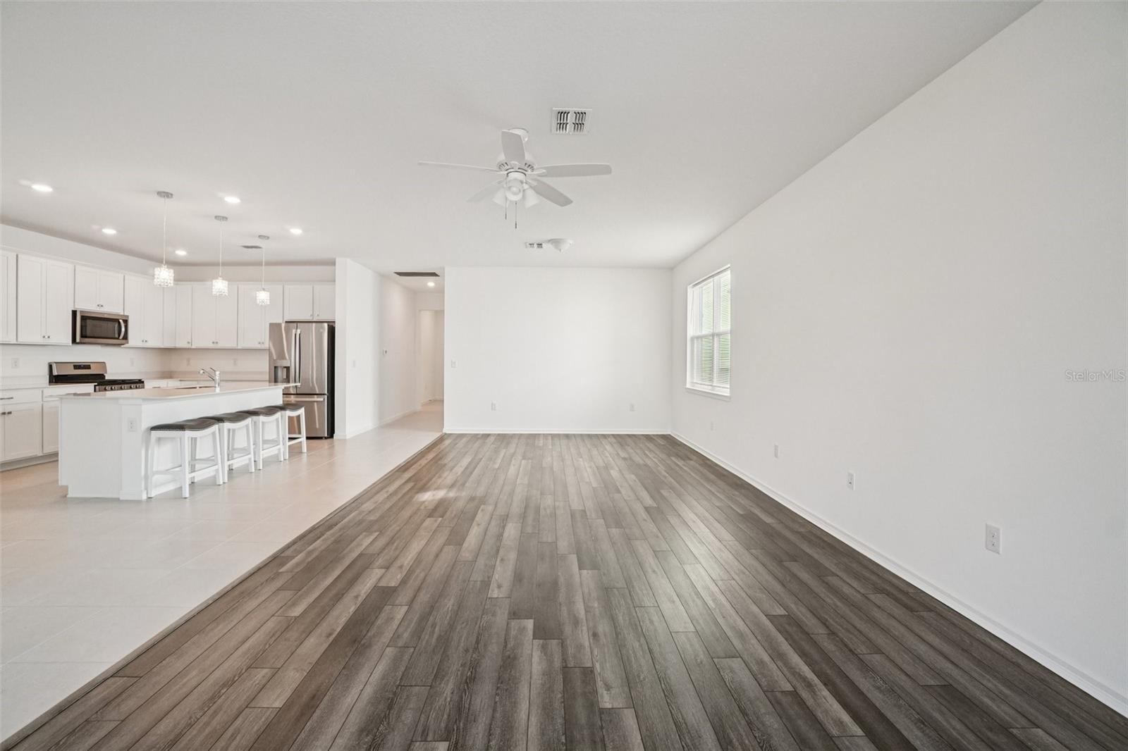 KITCHEN OVERLOOKS LIVING ROOM/DINING ROOM COMBO