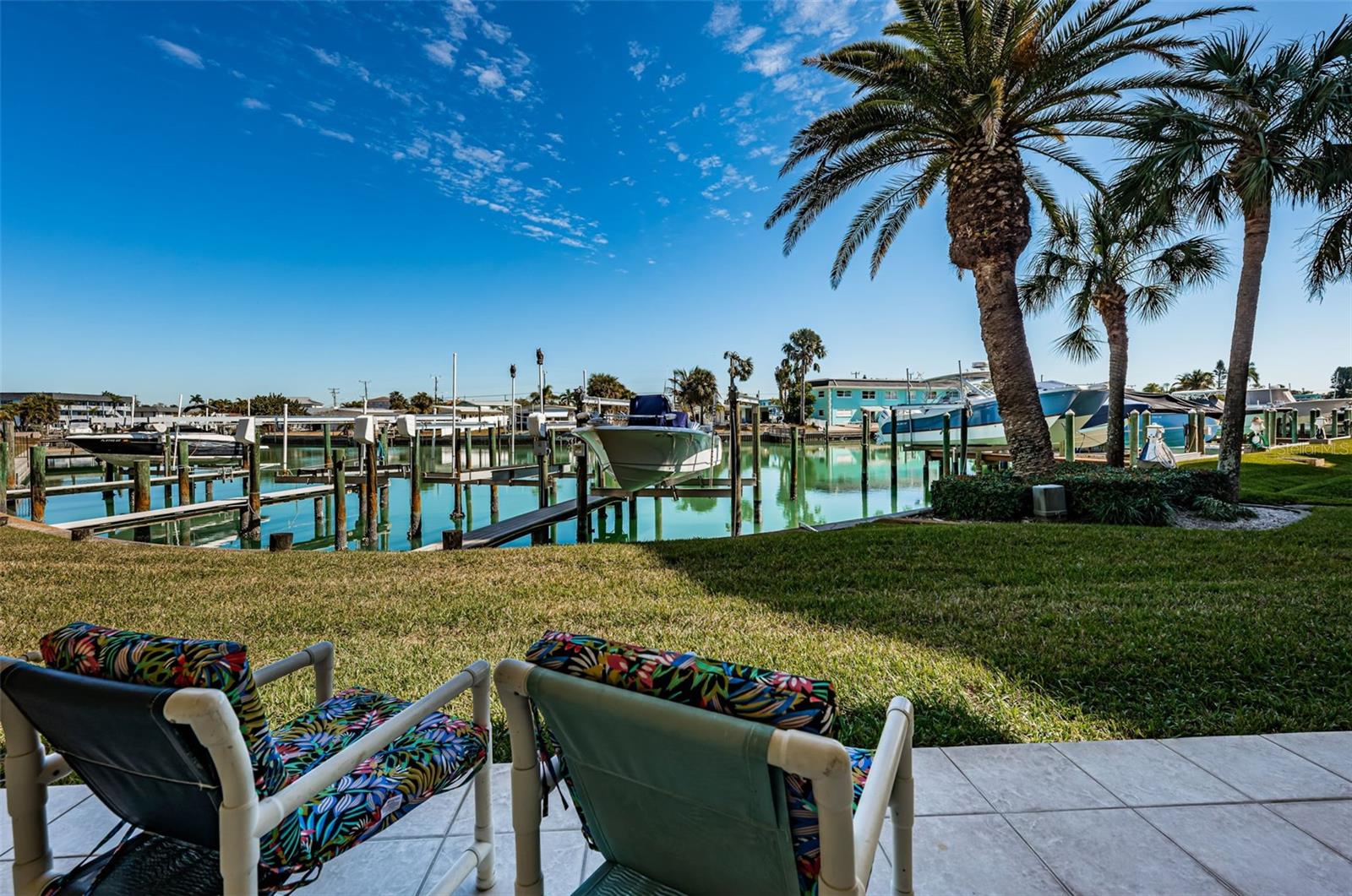 Patio from garage looking to boat slip and lift (2nd slio from the right)