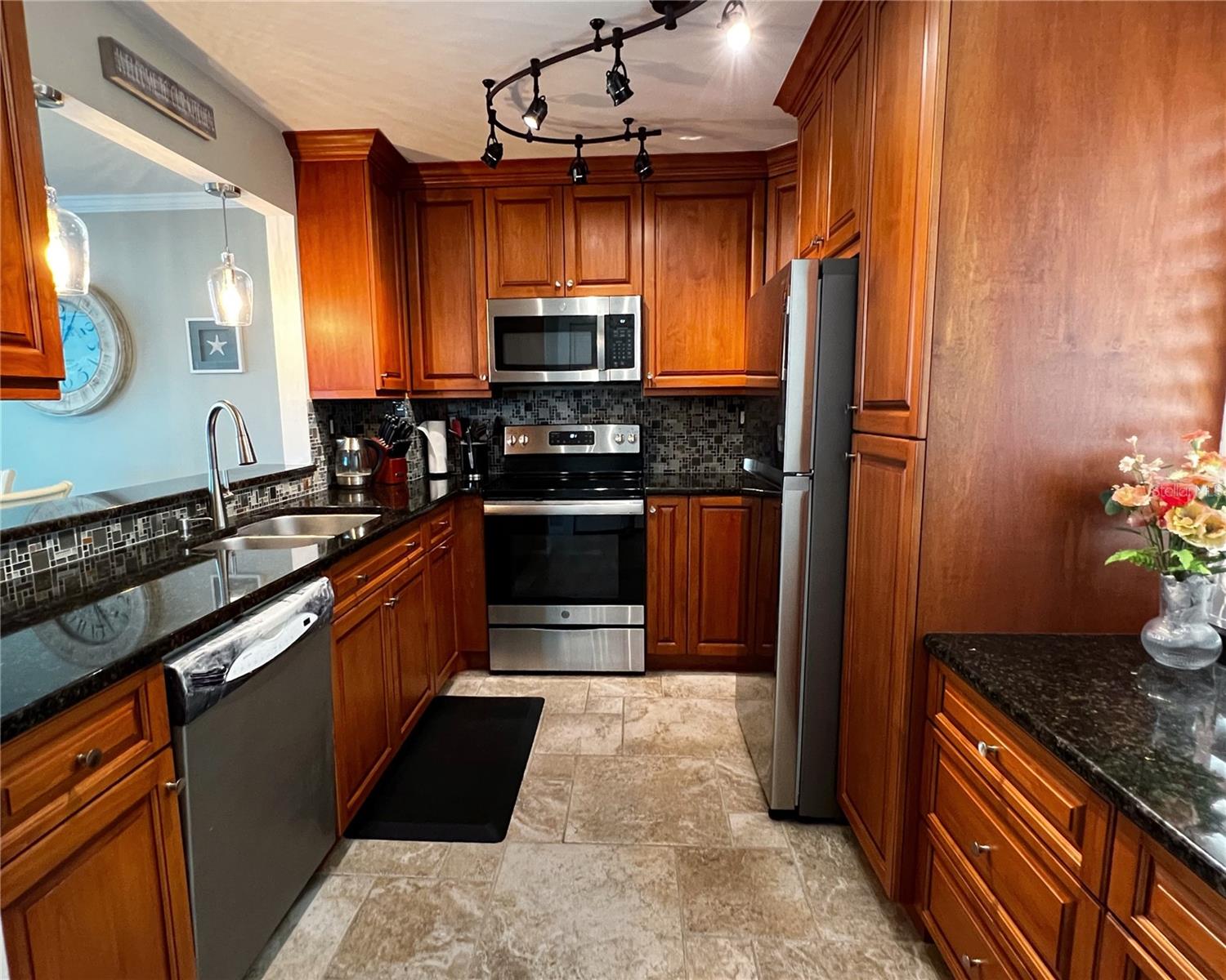 Updated kitchen with stainless steel appliances, plenty of storage space and counter space.