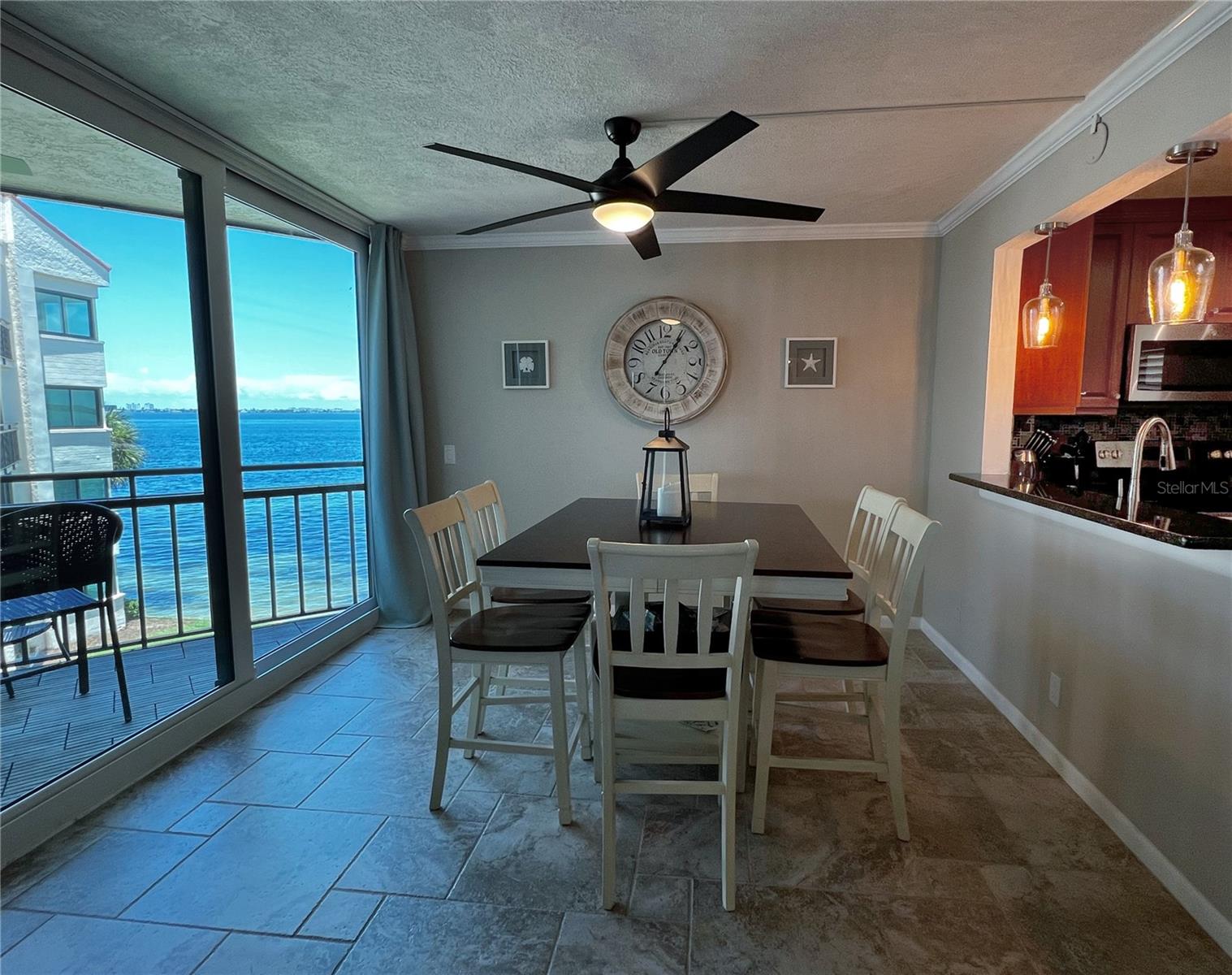 Waterfront dining room right beside the kitchen.